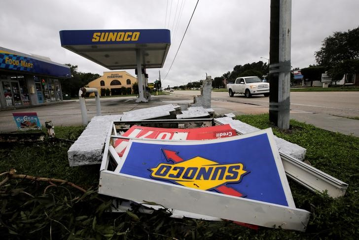 A sign of a Sunoco gas station, damaged by Hurricane Matthew, is seen in Melbourne
