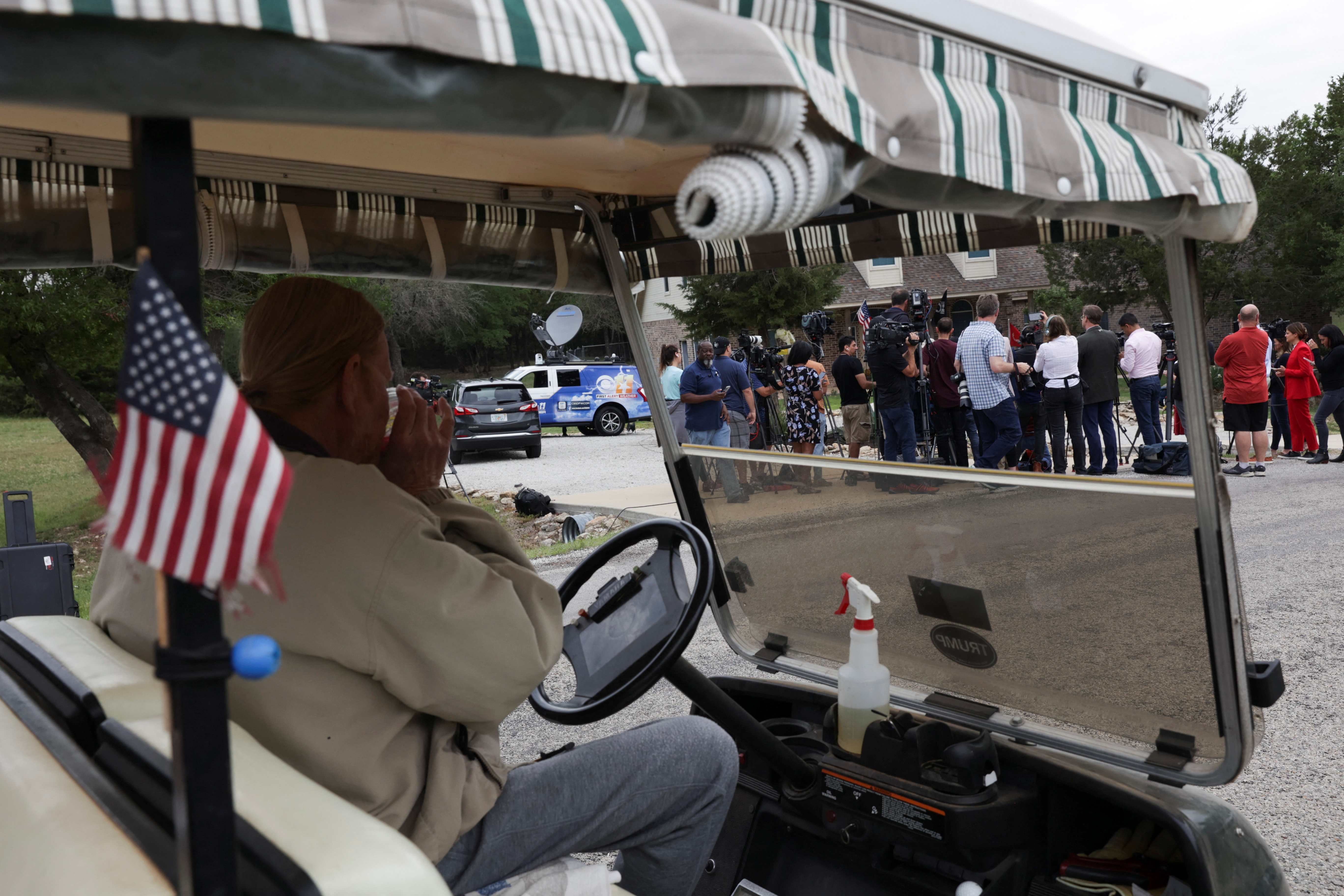 Neighbor Herby Mitchell watches a news conference concerning the homecoming of U.S. Marine Trevor Reed, in Granbury