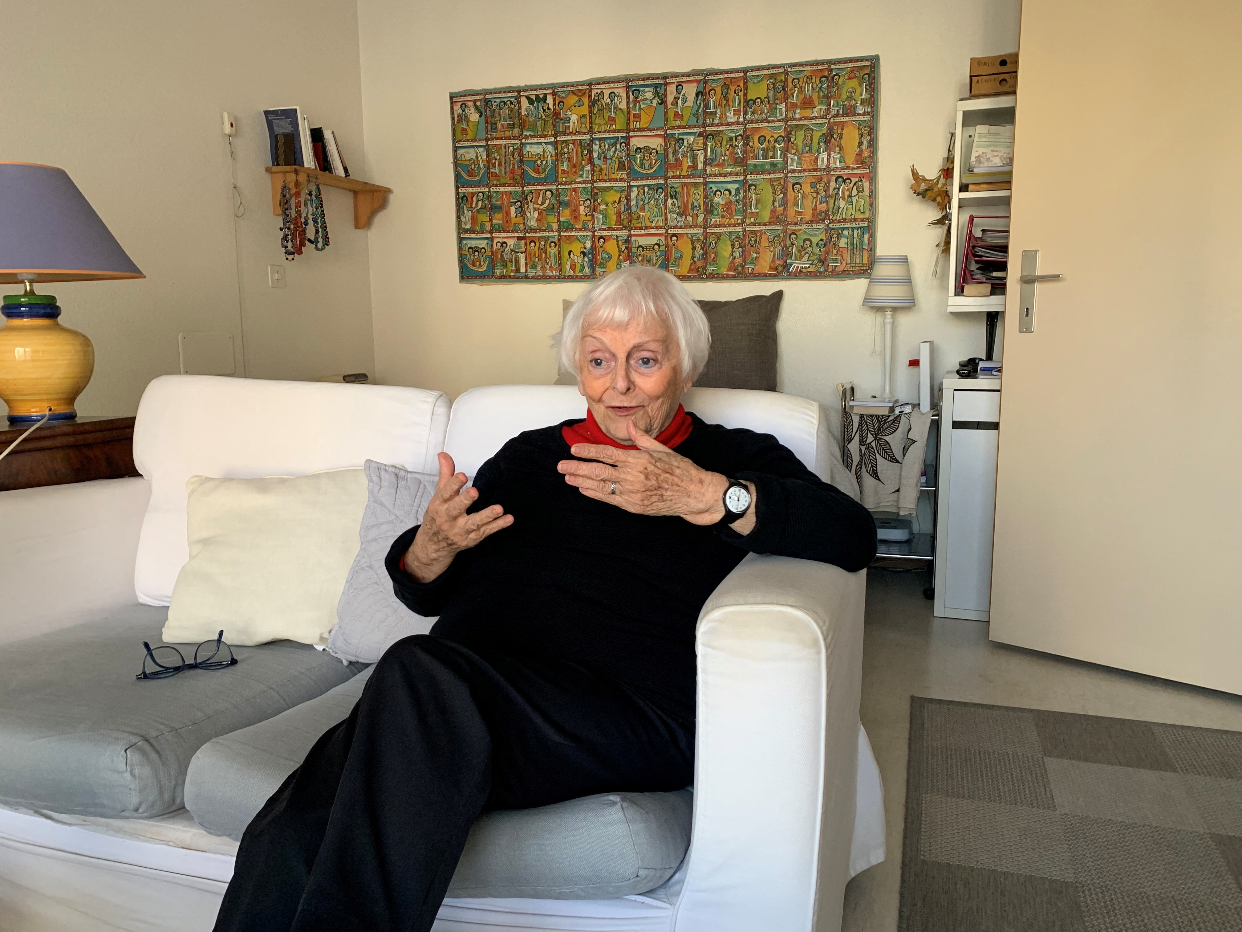 Marie-Eve Volkoff, 85, gestures during an interview in her apartment in Geneva