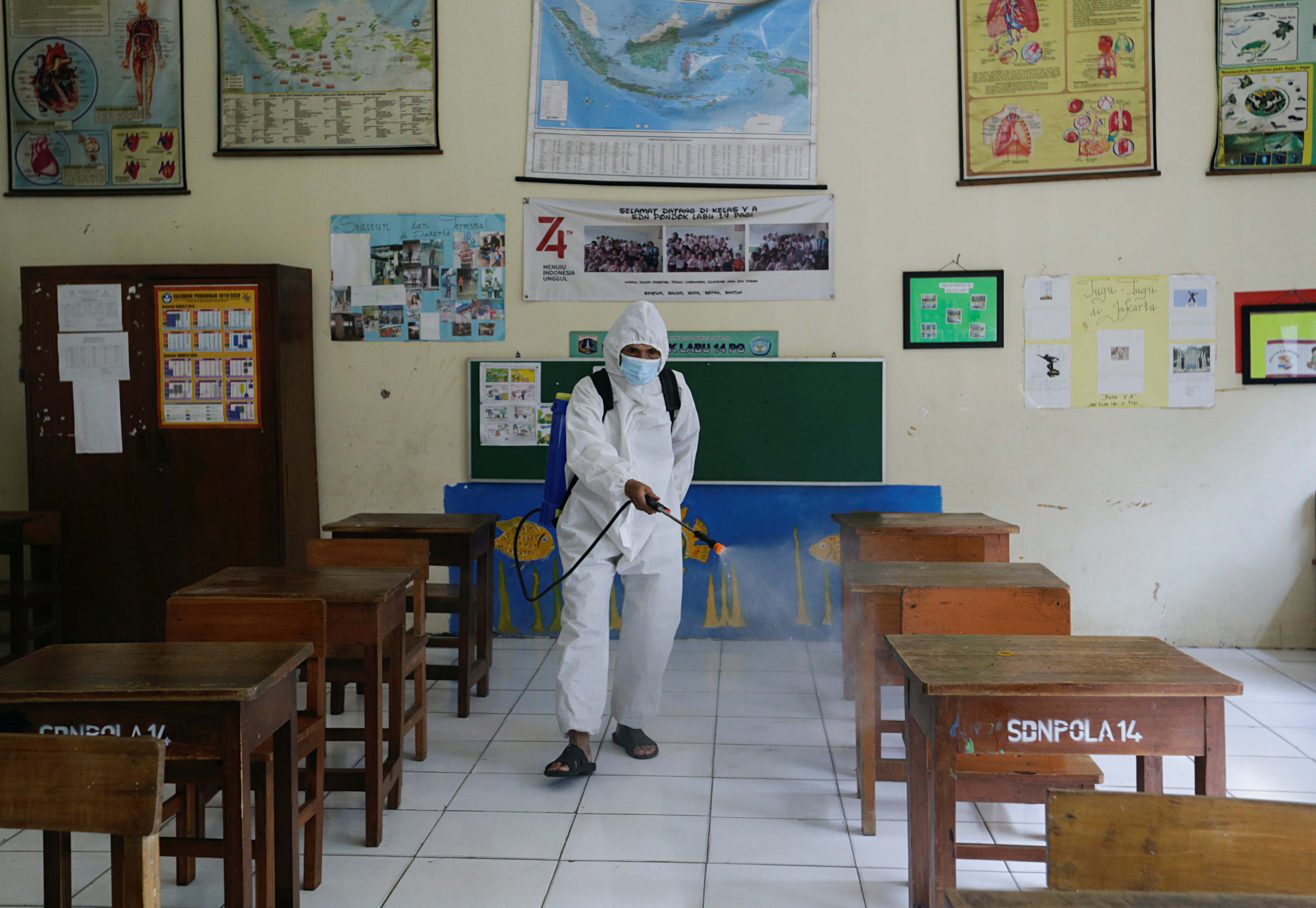 Schools reopen on trial basis as the government extends restrictions to curb the spread of coronavirus disease (COVID-19) in Jakarta