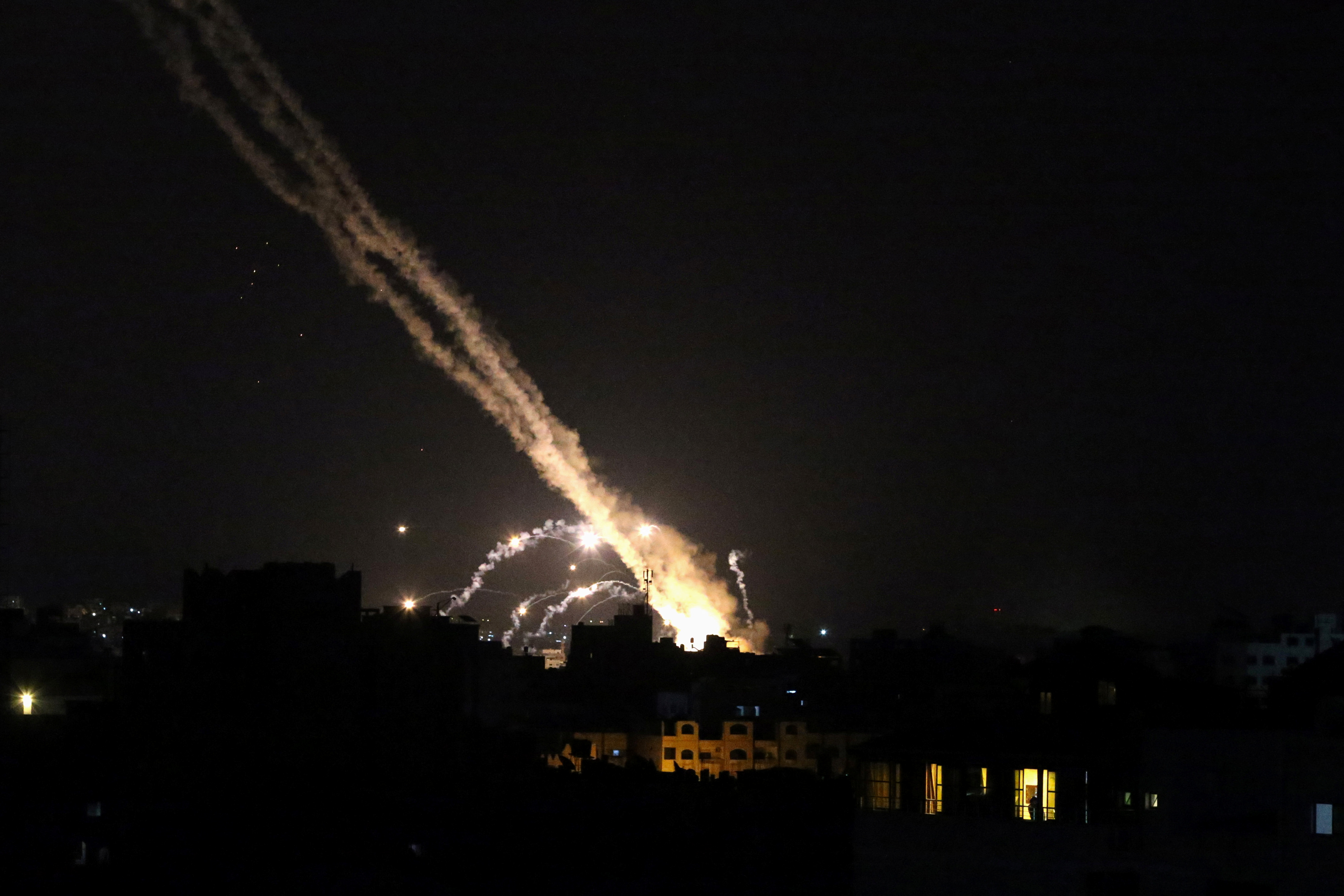 Rockets are launched by Palestinian militants into Israel, in Gaza May 13, 2021. REUTERS/Ibraheem Abu Mustafa