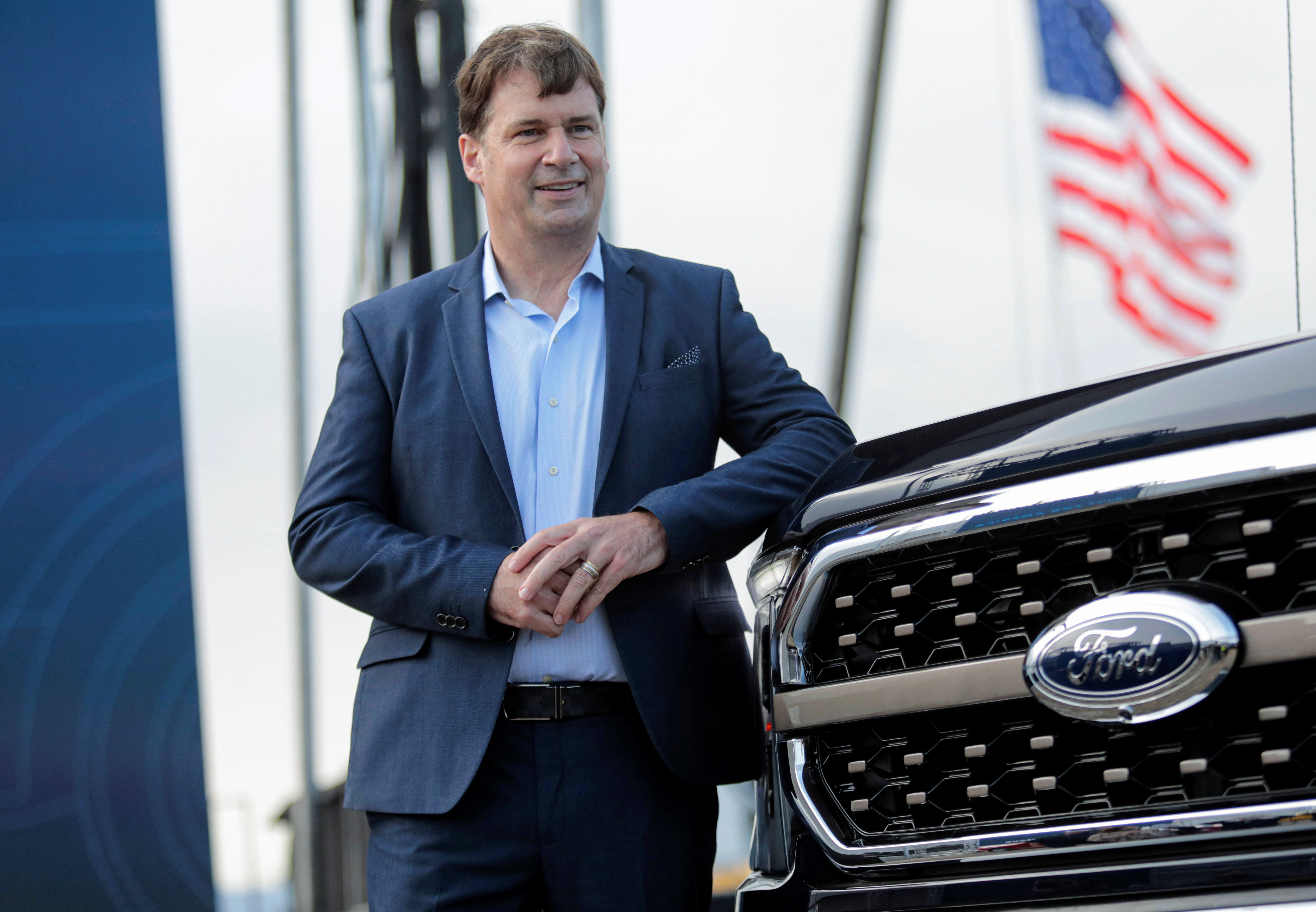 Ford Motor Co. CEO Jim Farley poses next to a new 2021 Ford F-150 pickup truck at the Rouge Complex in Dearborn,Michigan