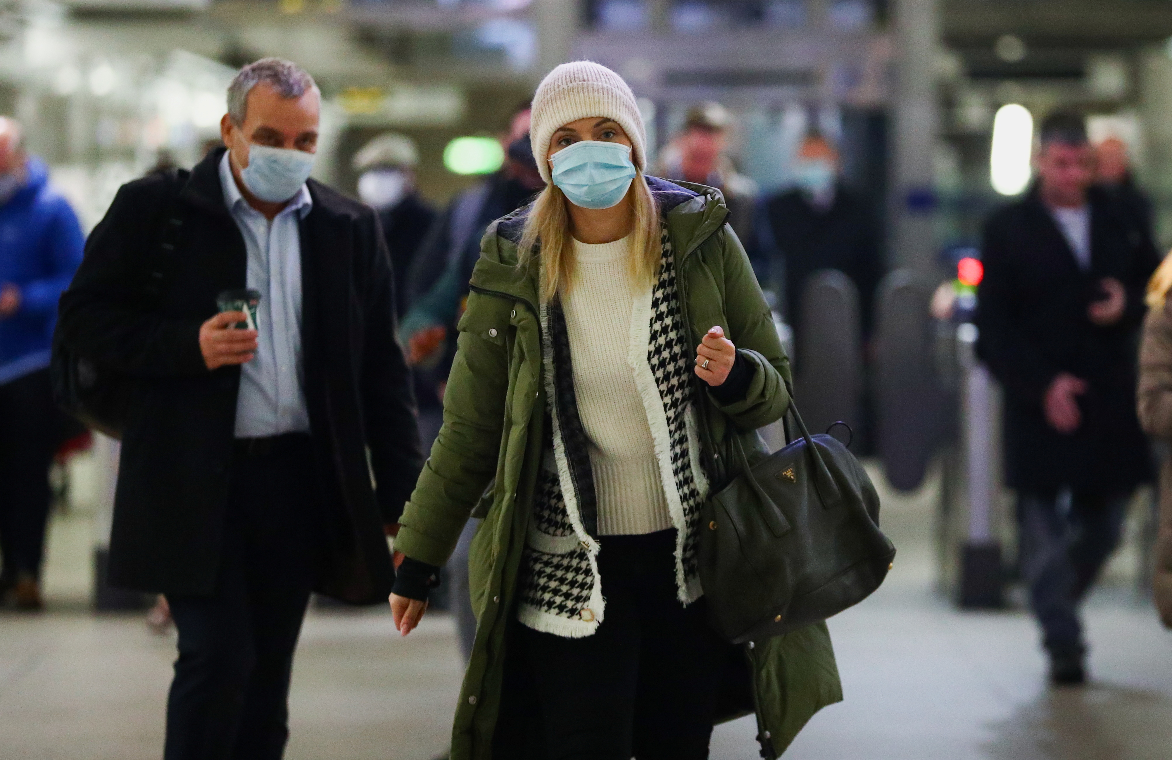People wear face masks on the London underground, as the spread of the coronavirus disease (COVID-19) continues in London, Britain, November 30, 2021. REUTERS/Hannah McKay