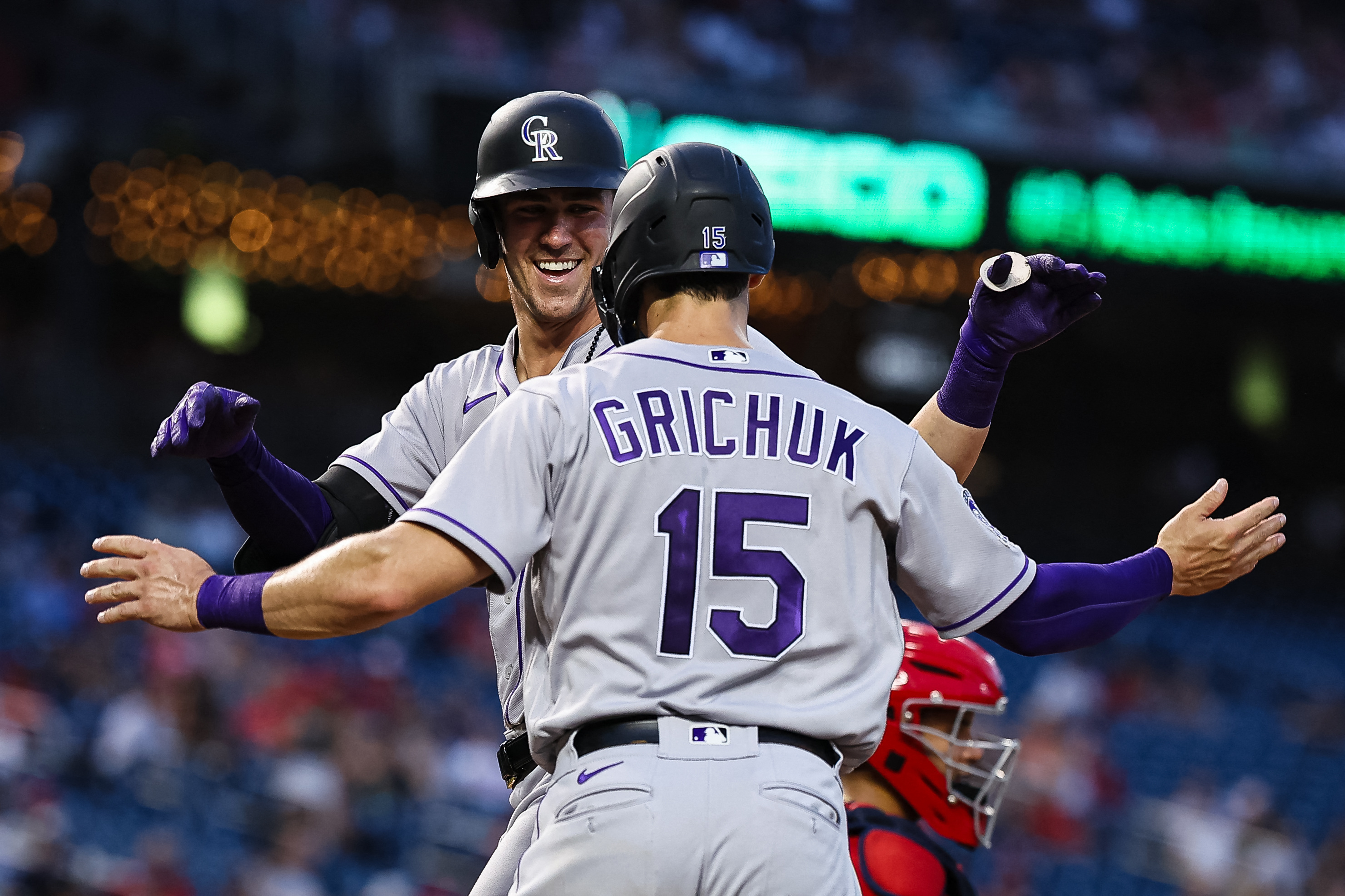 Randal Grichuk of the Colorado Rockies advances to third base in a