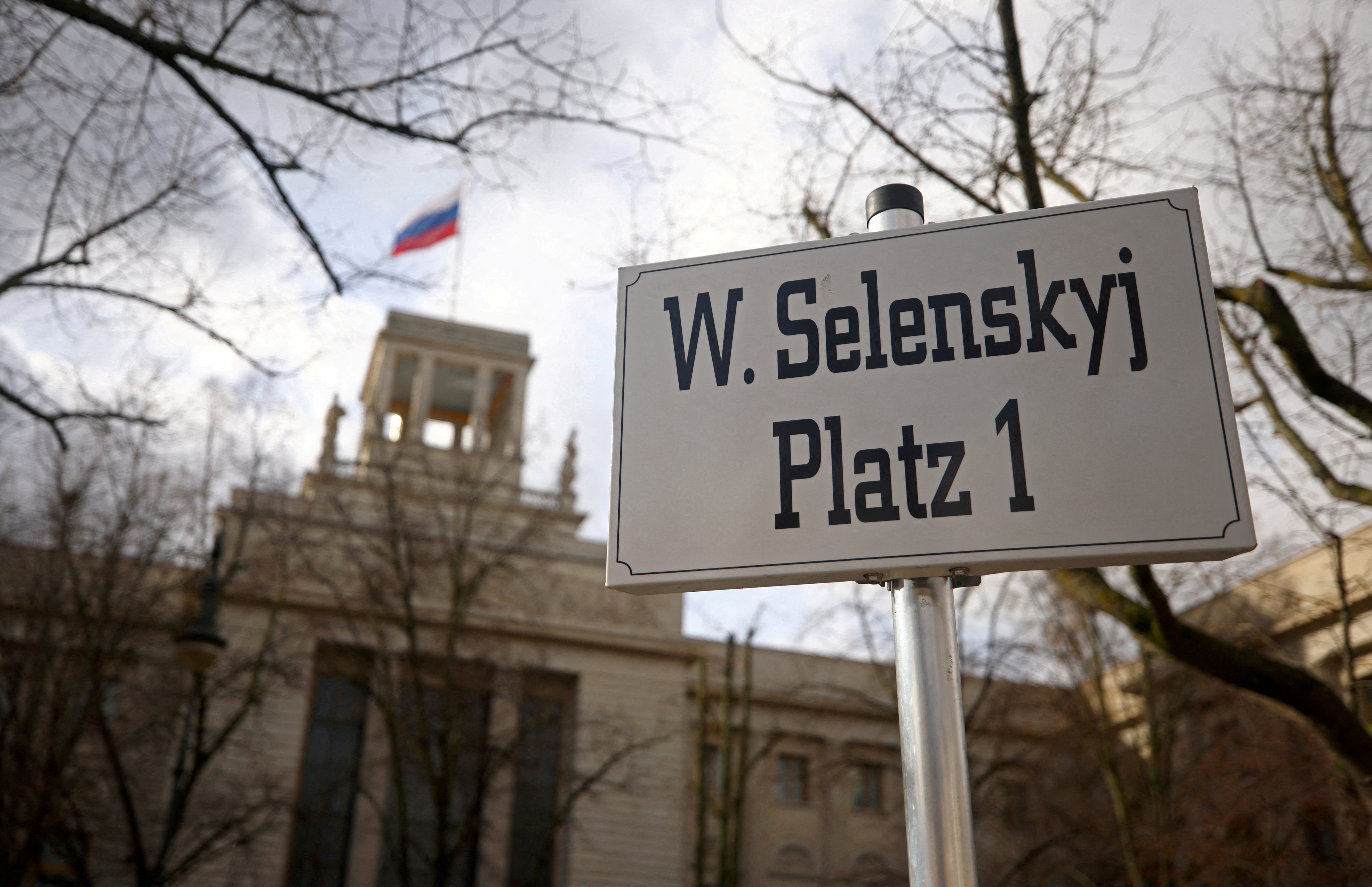 A sign with the name of Ukraine's President Zelenskiy is set up in front of the Russian embassy in Berlin