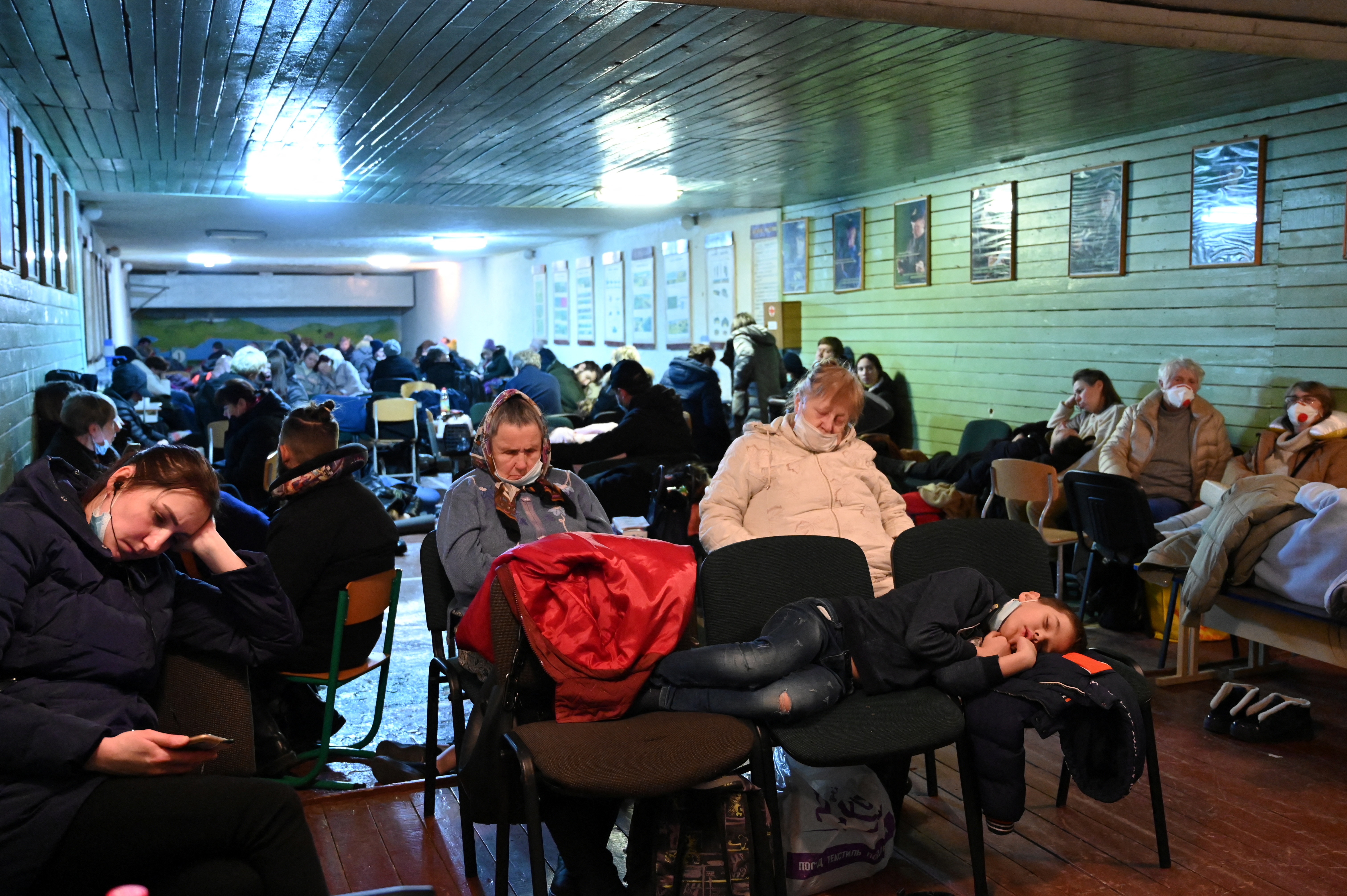 People gather in an air raid shelter in Kyiv