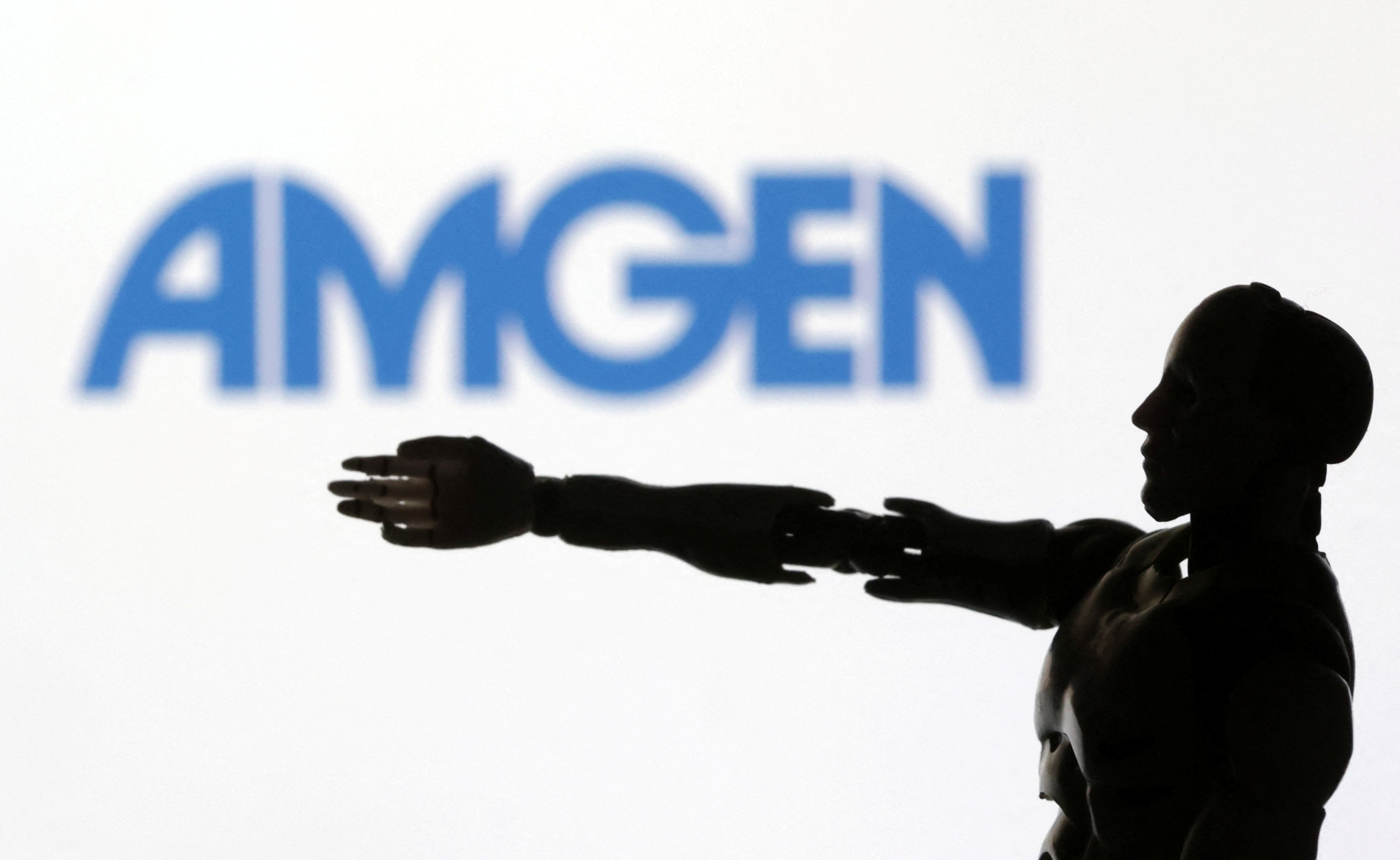 Illustration shows the logo of Amgen and a robot miniature