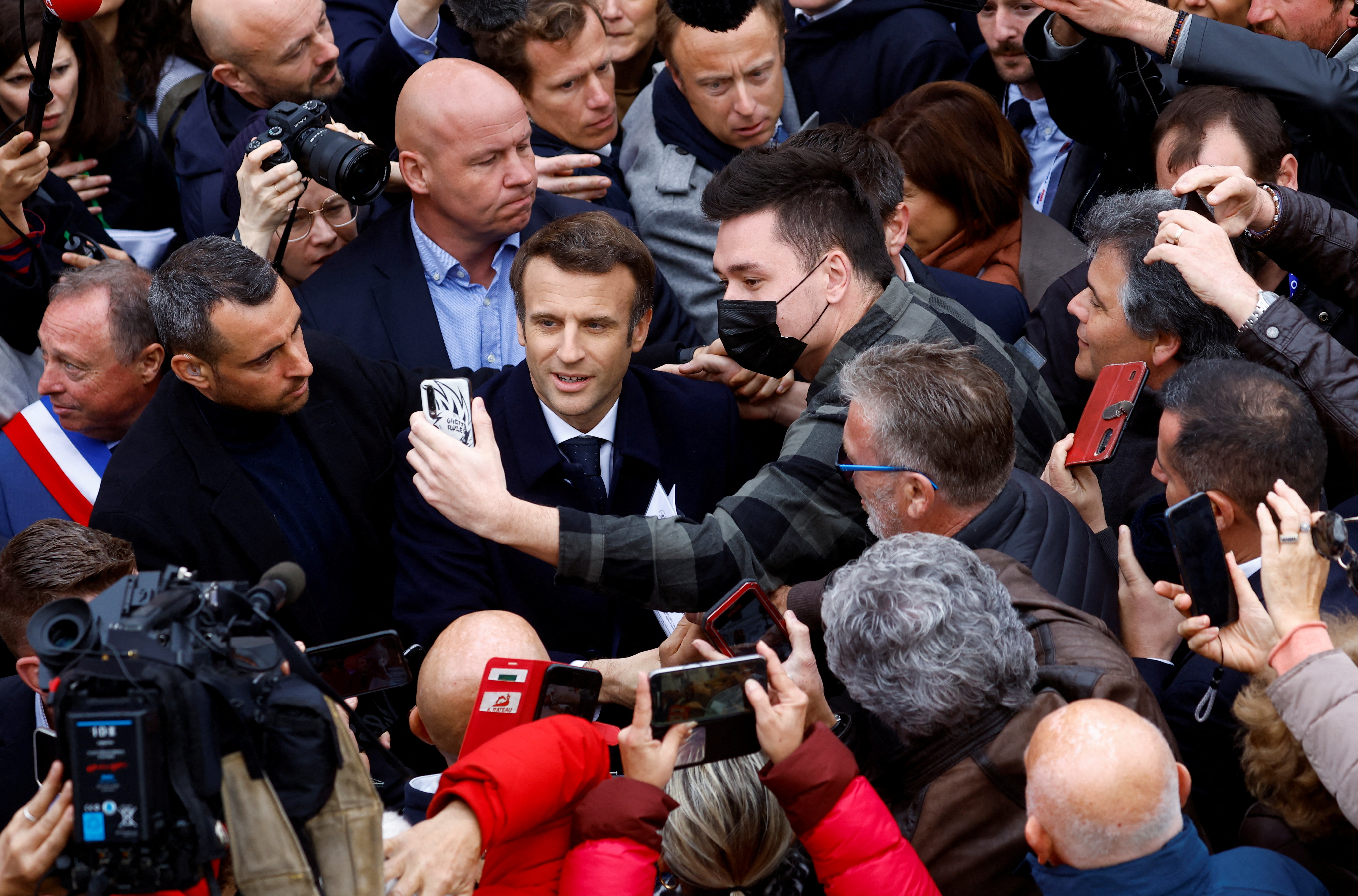 French President and centrist LREM party candidate for re-election Macron campaigns in Charente-Maritime