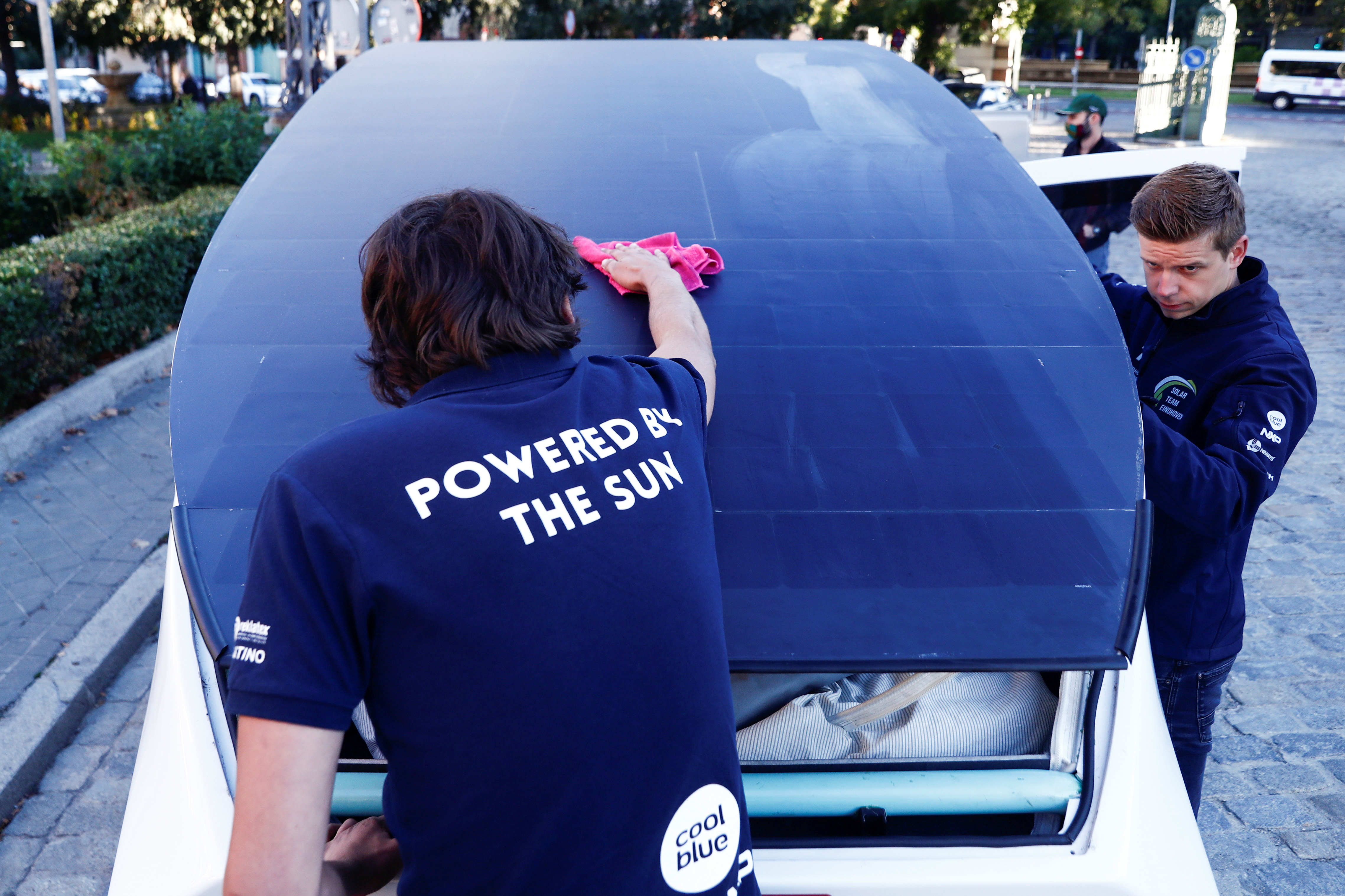 A student from Eindhoven's Technical University cleans Stella Vita vehicle in Spain