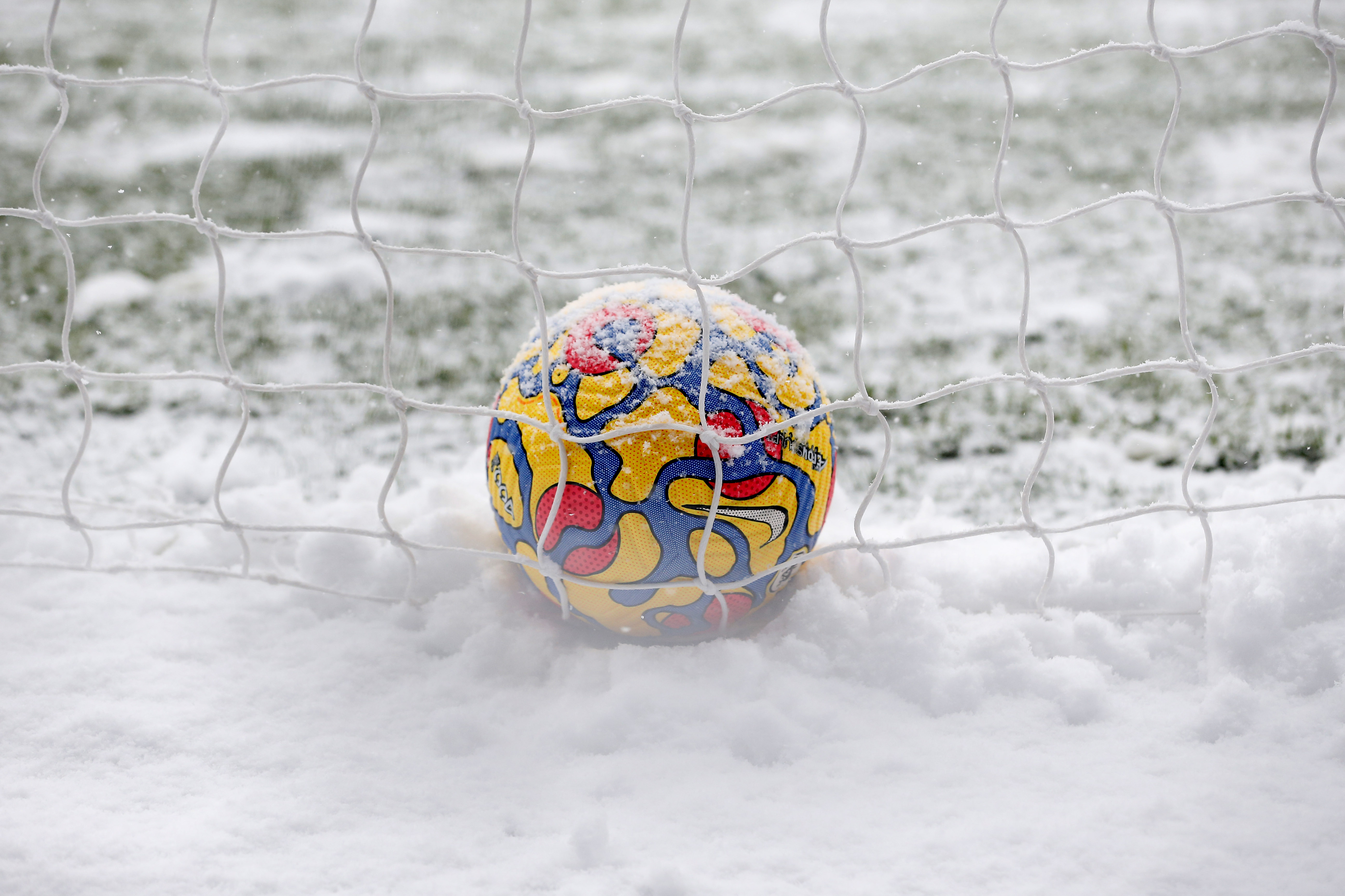 Soccer Football - Premier League - Burnley v Tottenham Hotspur - Turf Moor, Burnley, Britain - November 28, 2021 General view of the match ball covered in snow before the match REUTERS/Craig Brough  
