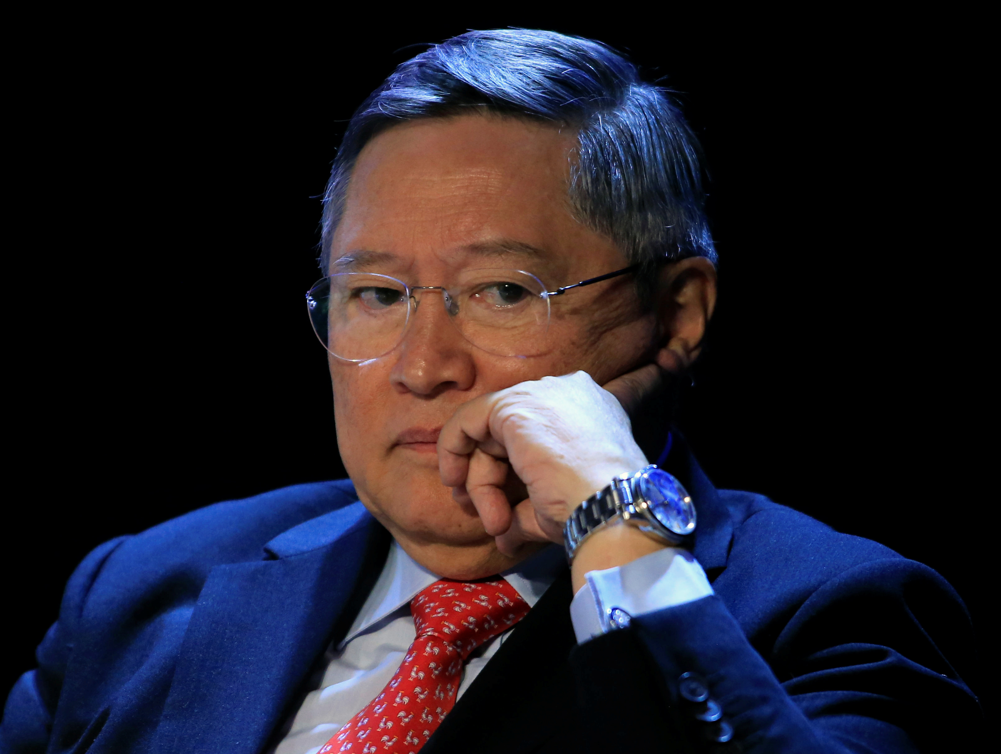 Philippine Finance Secretary Carlos Dominguez gestures as he listen to a questions during a 