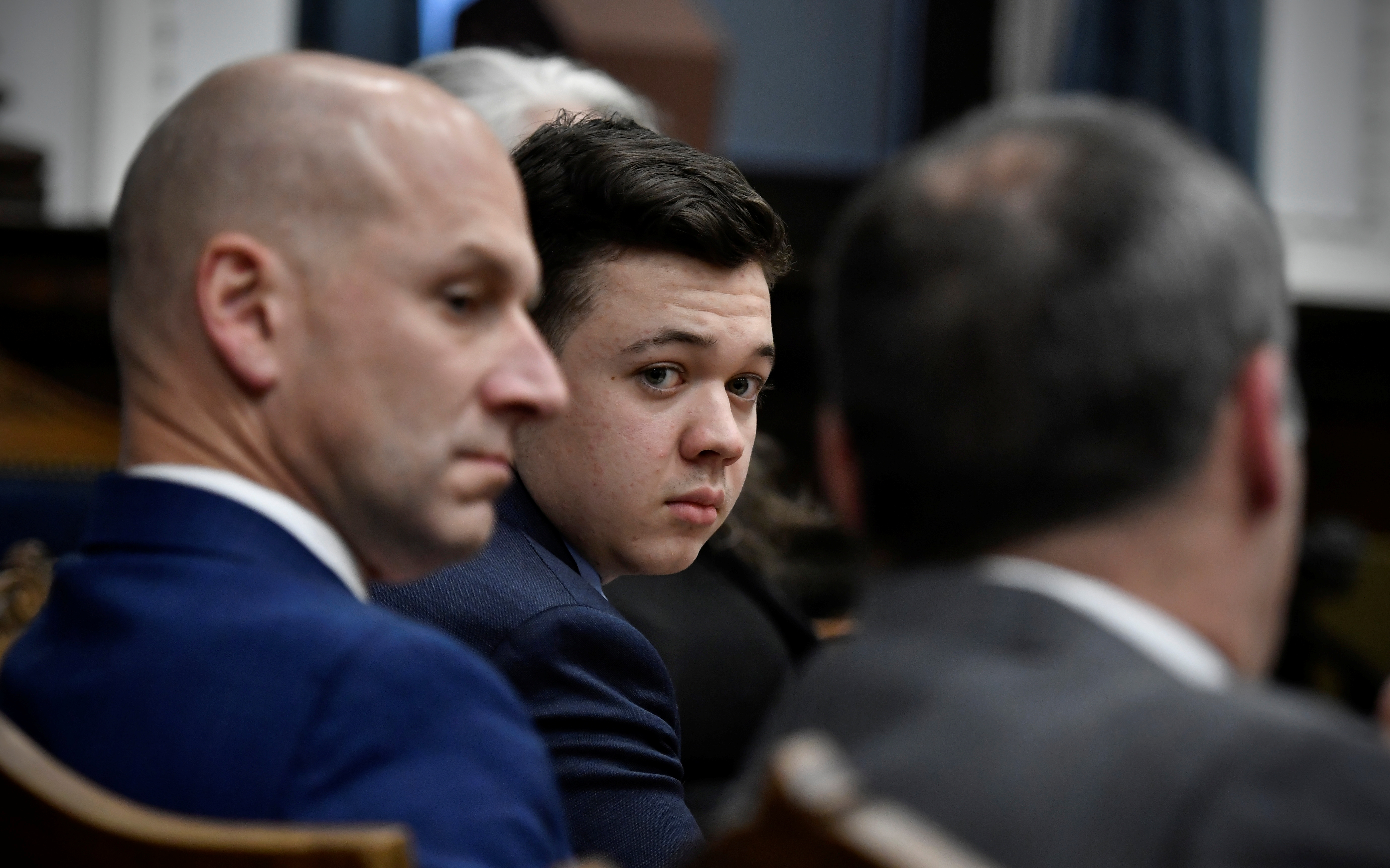 Kyle Rittenhouse looks over to his attorneys as the jury is dismissed for the day during his trial at the Kenosha County Courthouse in Kenosha, U.S., November 18, 2021. Sean Krajacic/Pool via REUTERS