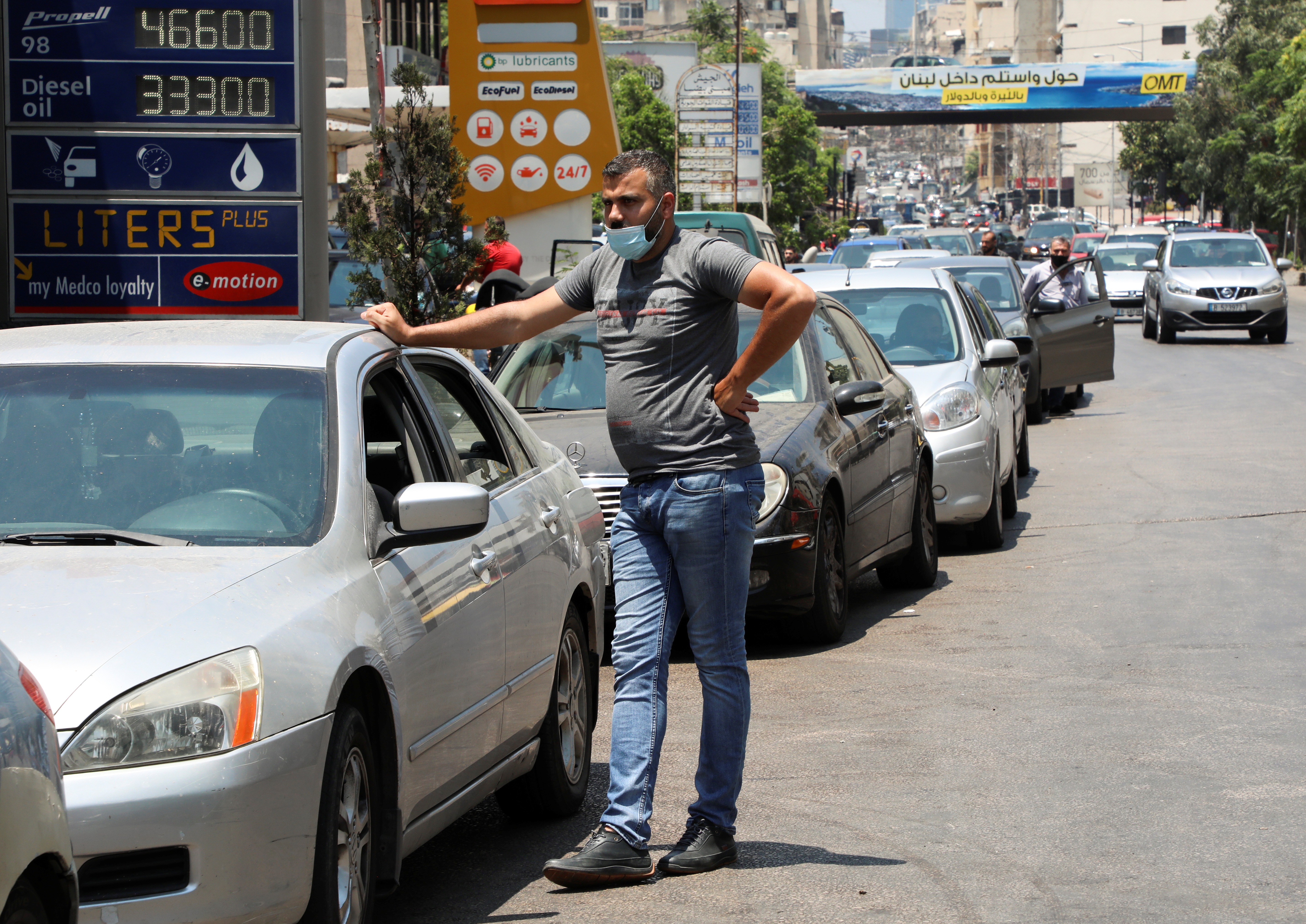 Cars queue for fuel at a gas station in Beirut