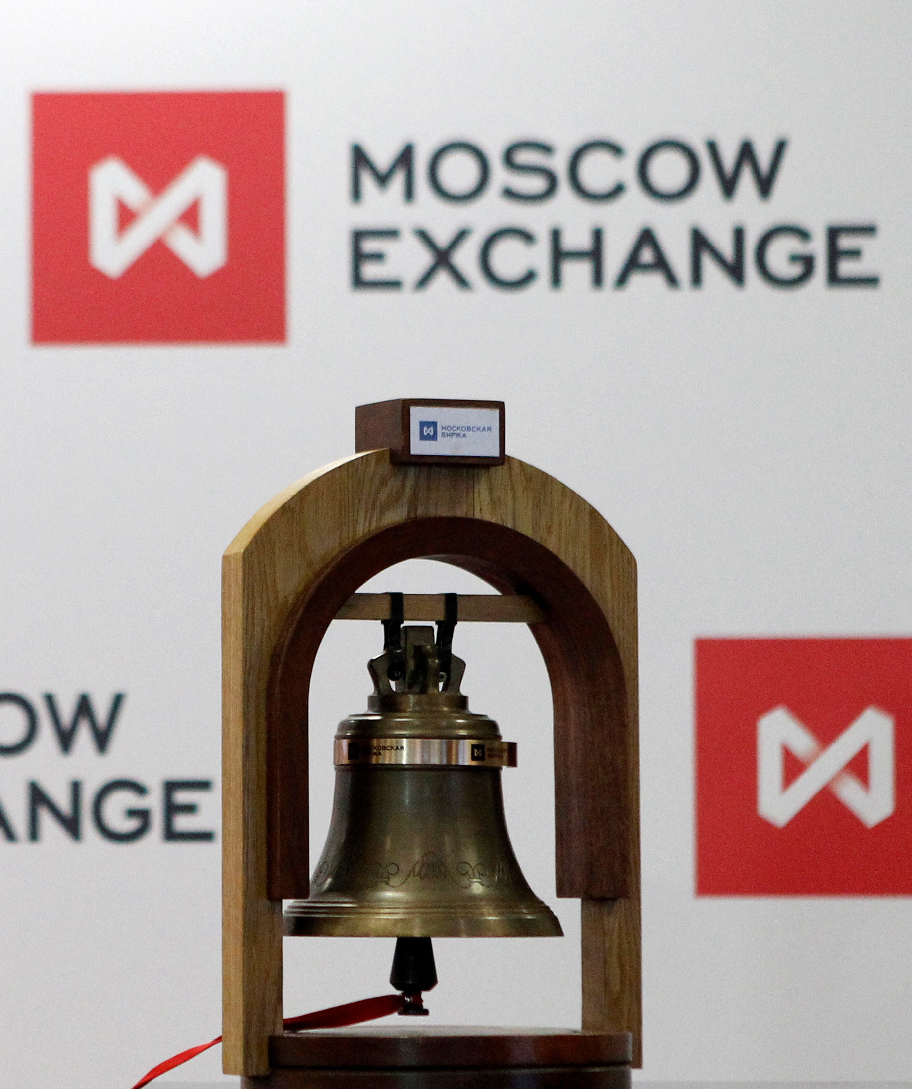 The bell rung at the beginning of trading sessions is seen in front of the logo of the Moscow Exchange after the start of trading in Moscow
