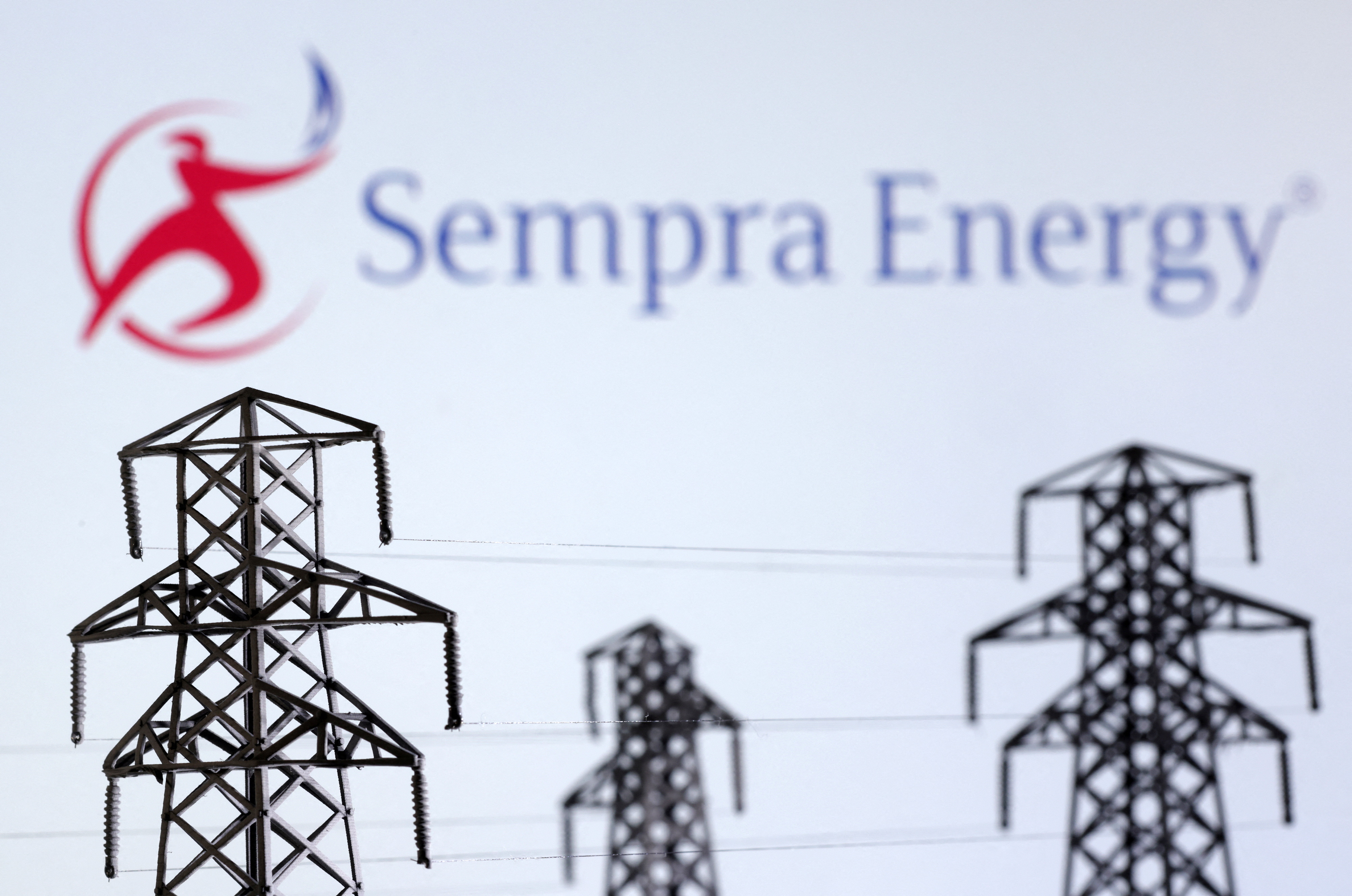 Illustration shows Electric power transmission pylon miniatures and Sempra Energy logo