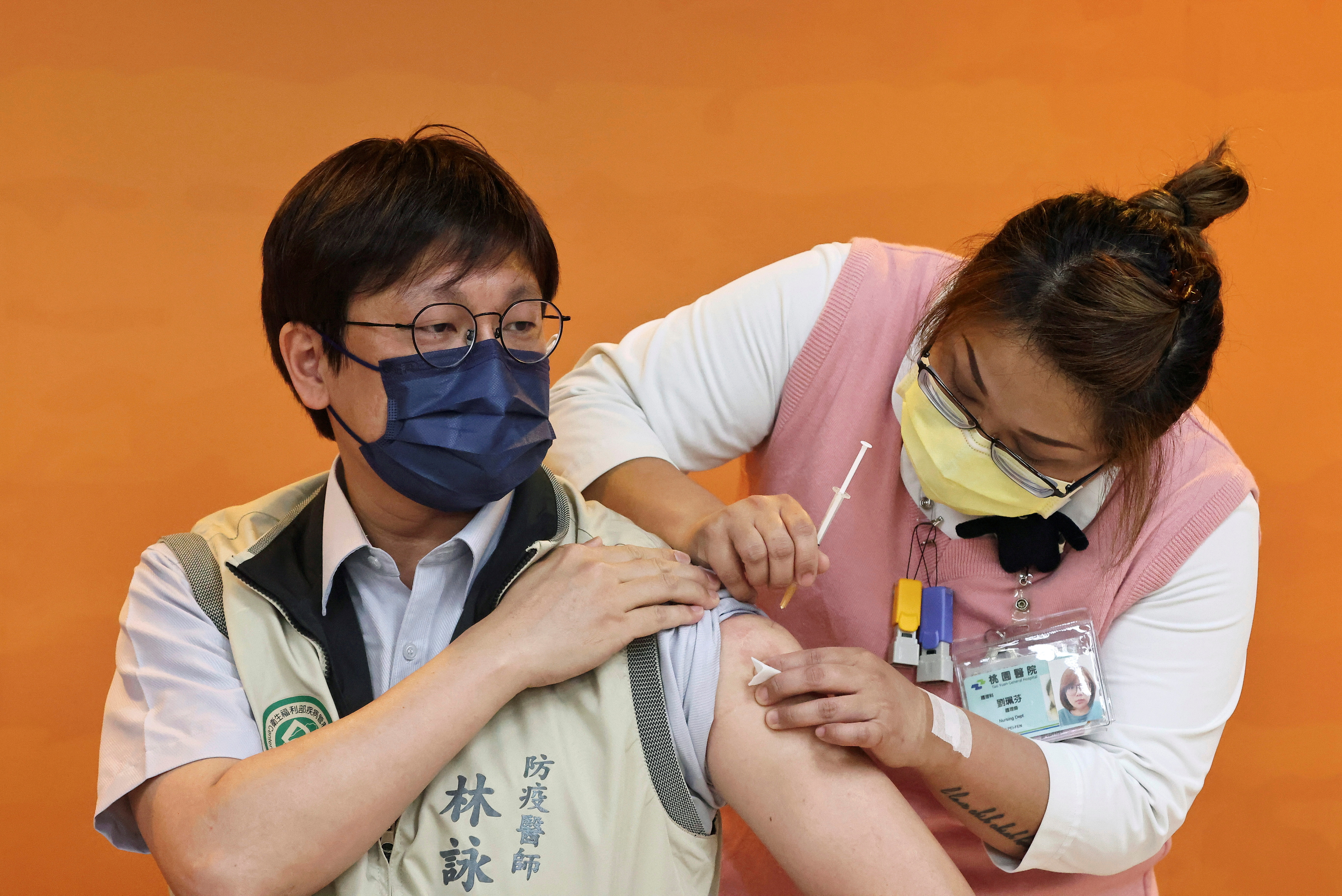 A doctor receives a dose of the AstraZeneca vaccine against the coronavirus in Taoyuan, Taiwan
