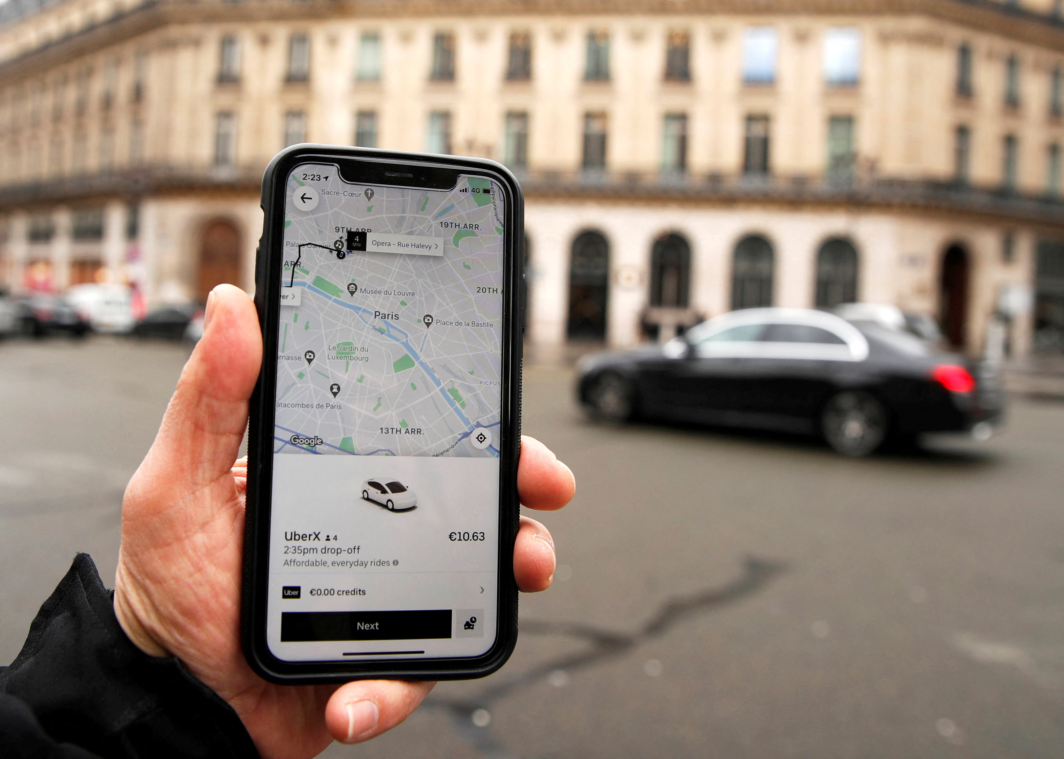 A photo Illustration shows the Uber application on a mobile phone in in central Paris