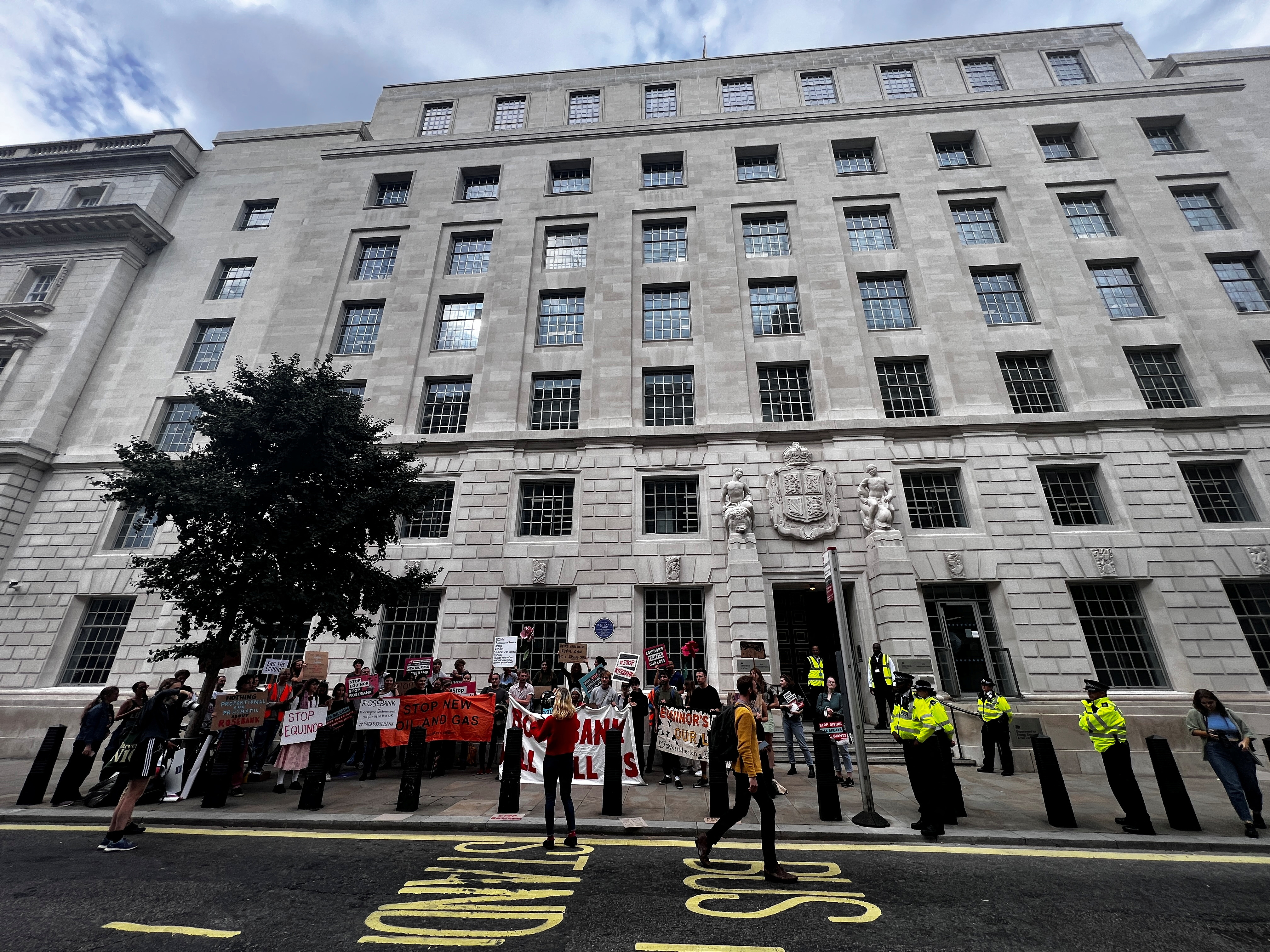 People protest outside the Department for Energy and Net Zero in London