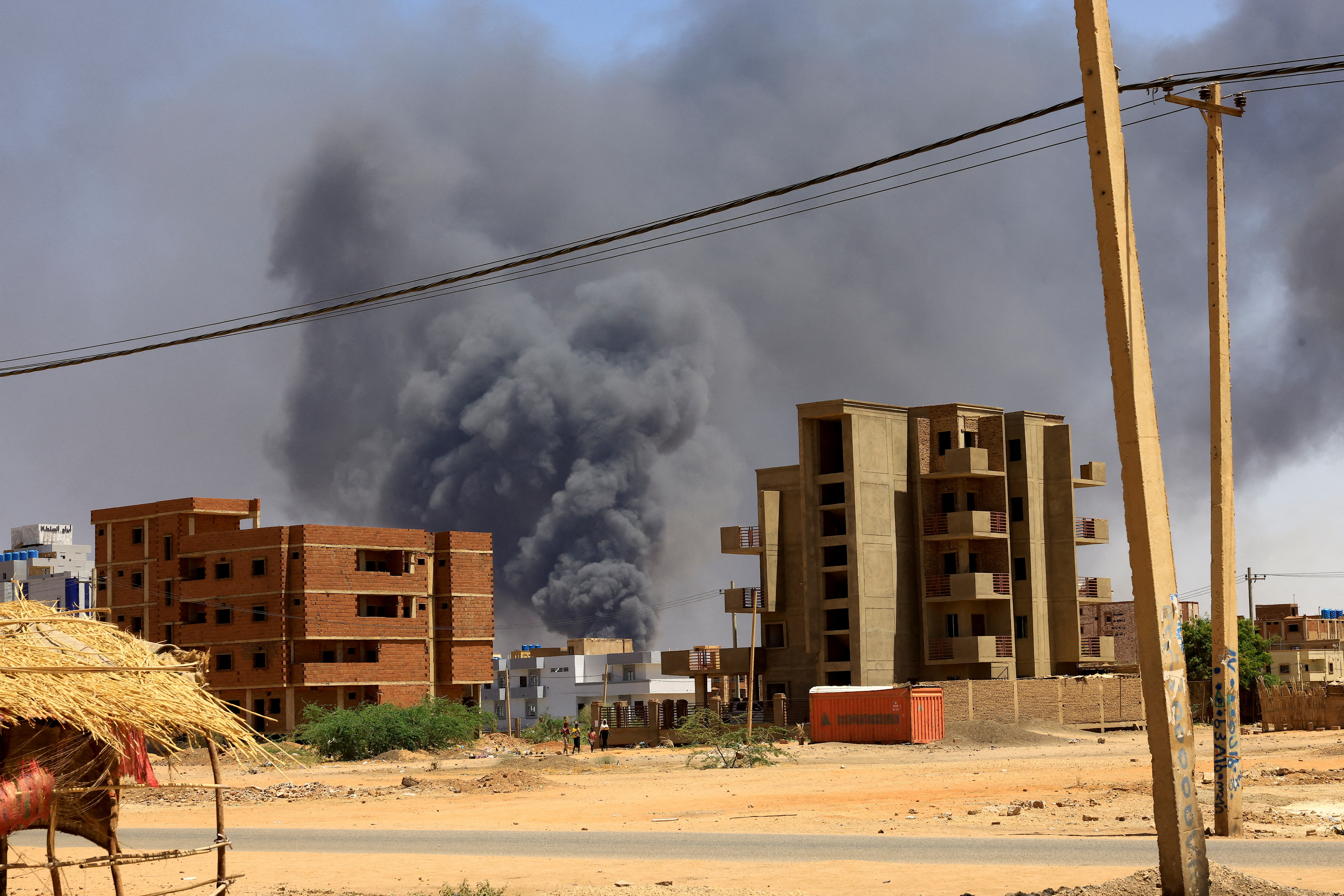 Smoke rises above buildings after an aerial bombardment in Khartoum North