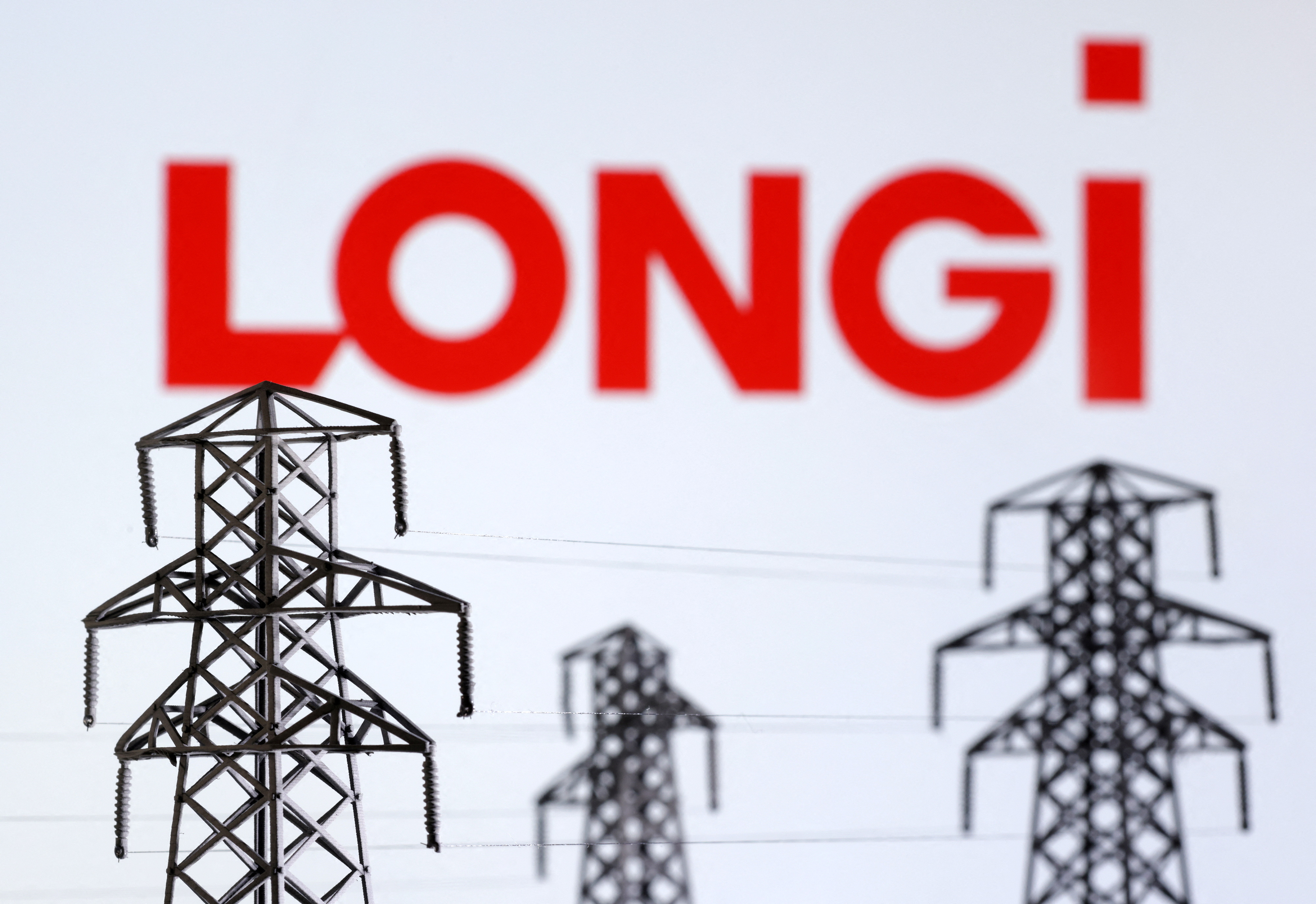 Illustration shows Electric power transmission pylon miniatures and LONGi Green Energy Technology logo