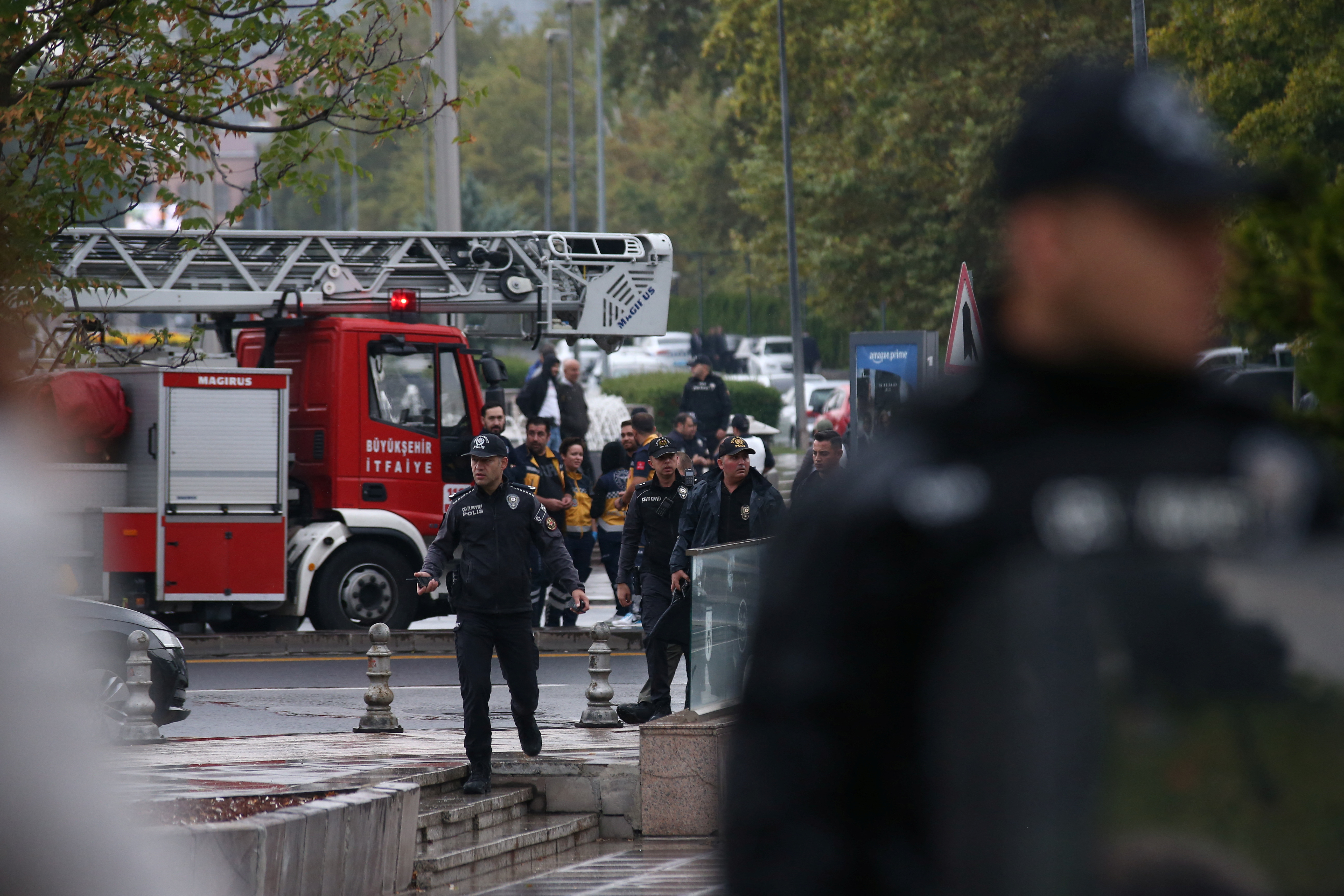 Police officers secure an area near the Interior Ministry following a bomb attack in Ankara