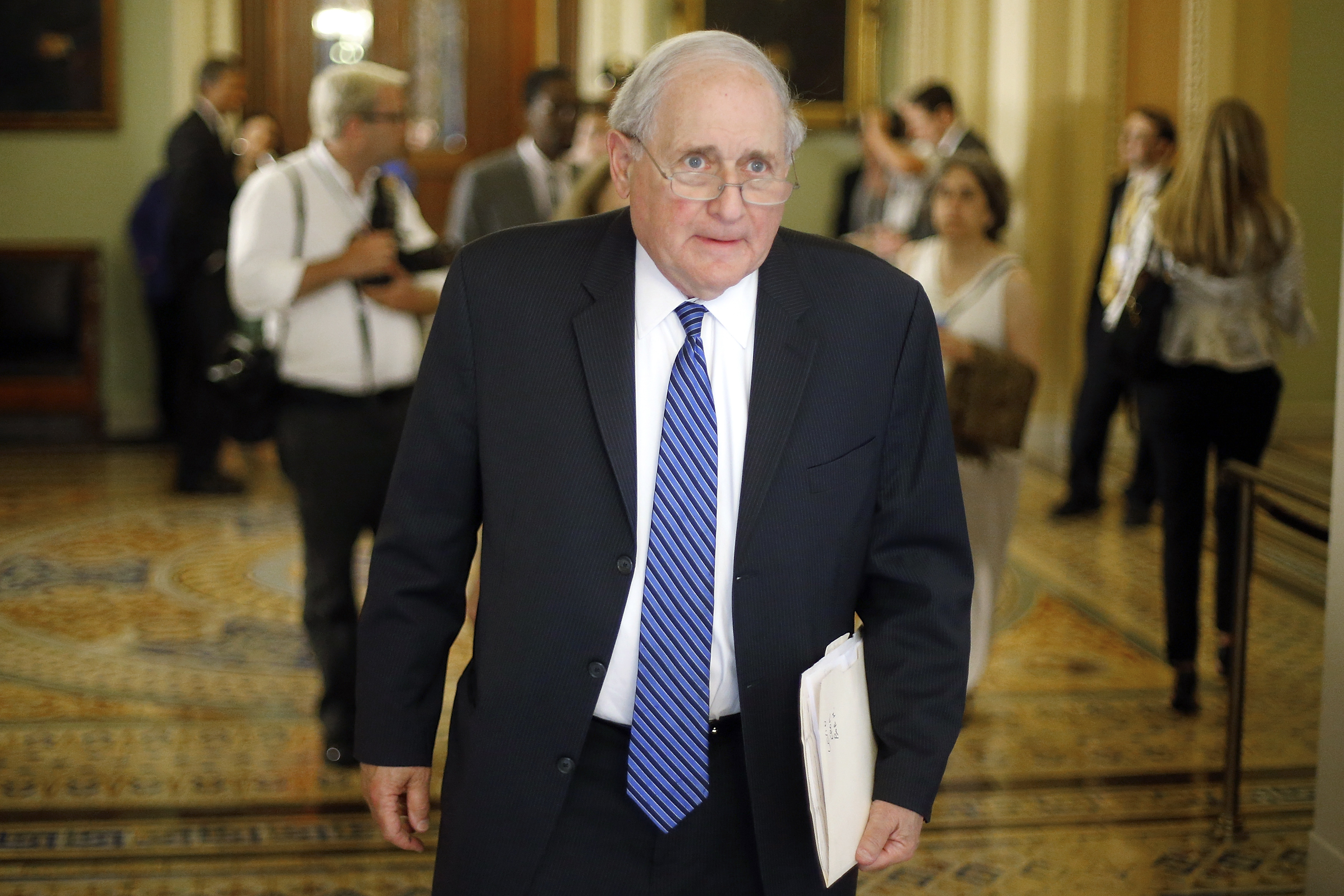 U.S. Senator Levin departs following the weekly Democratic caucus policy luncheon at the U.S. Capitol in Washington