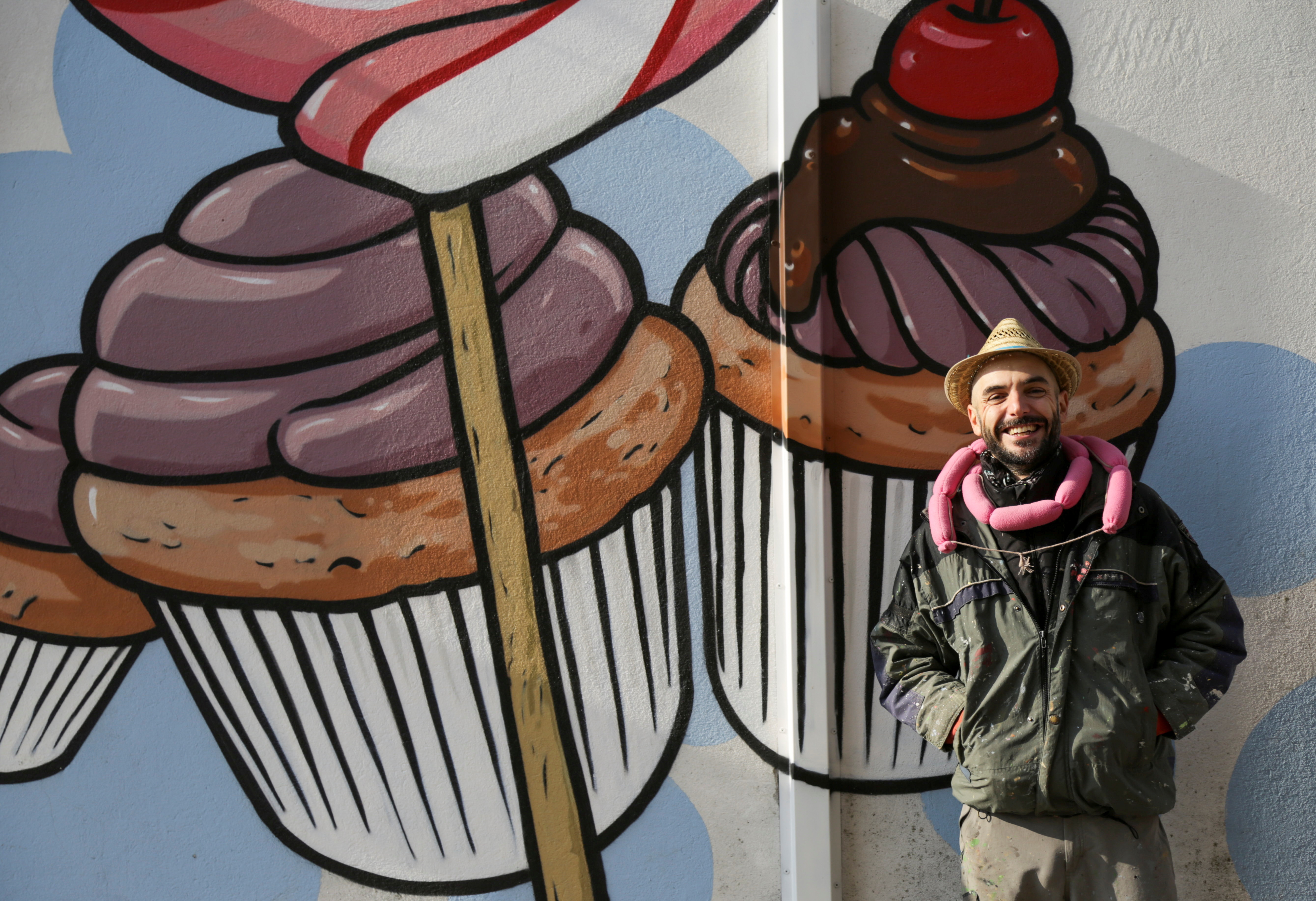 Italian street artist takes on racism with murals of food, near Verona