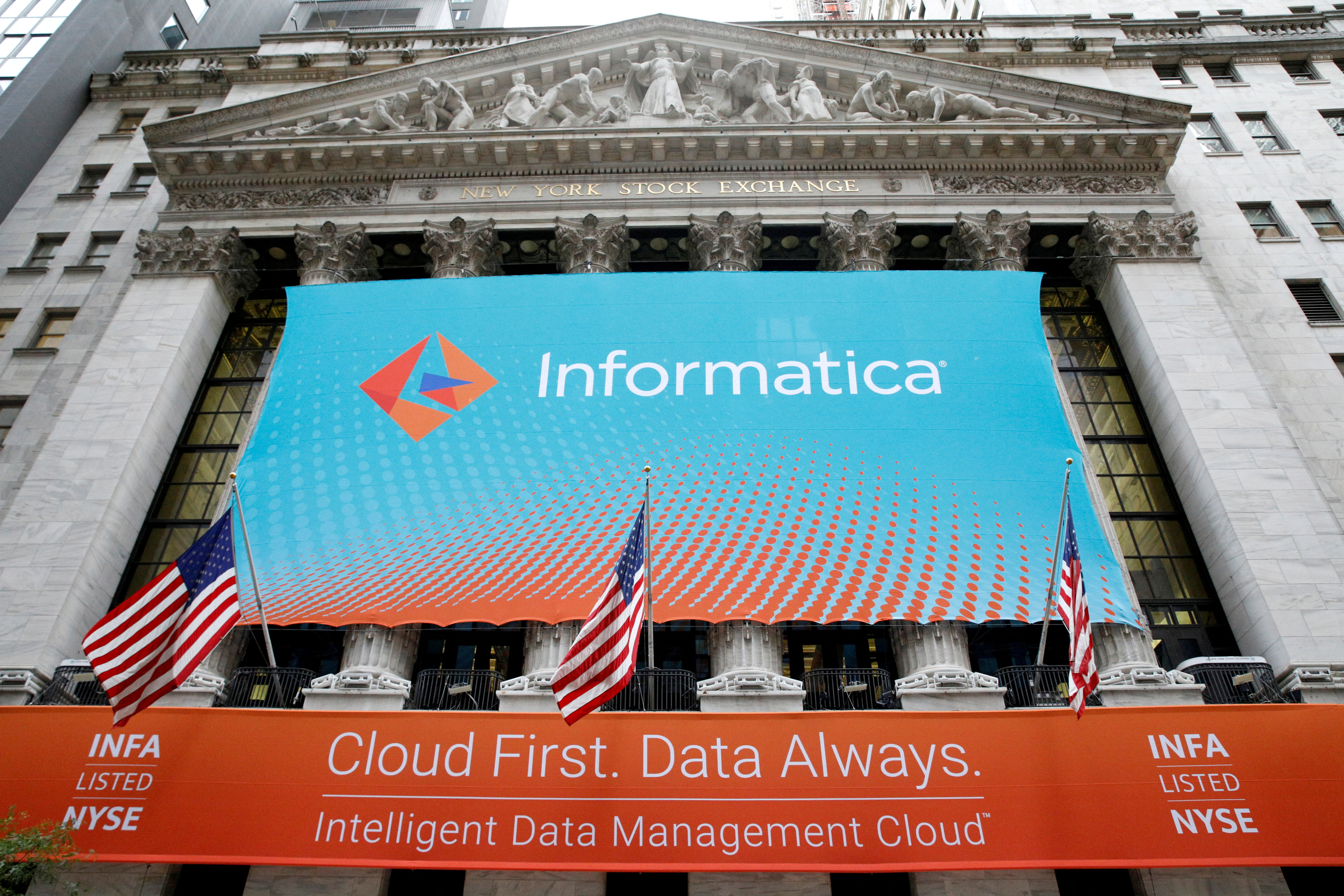 A banner celebrating the Informatica IPO on the front of the NYSE in New York