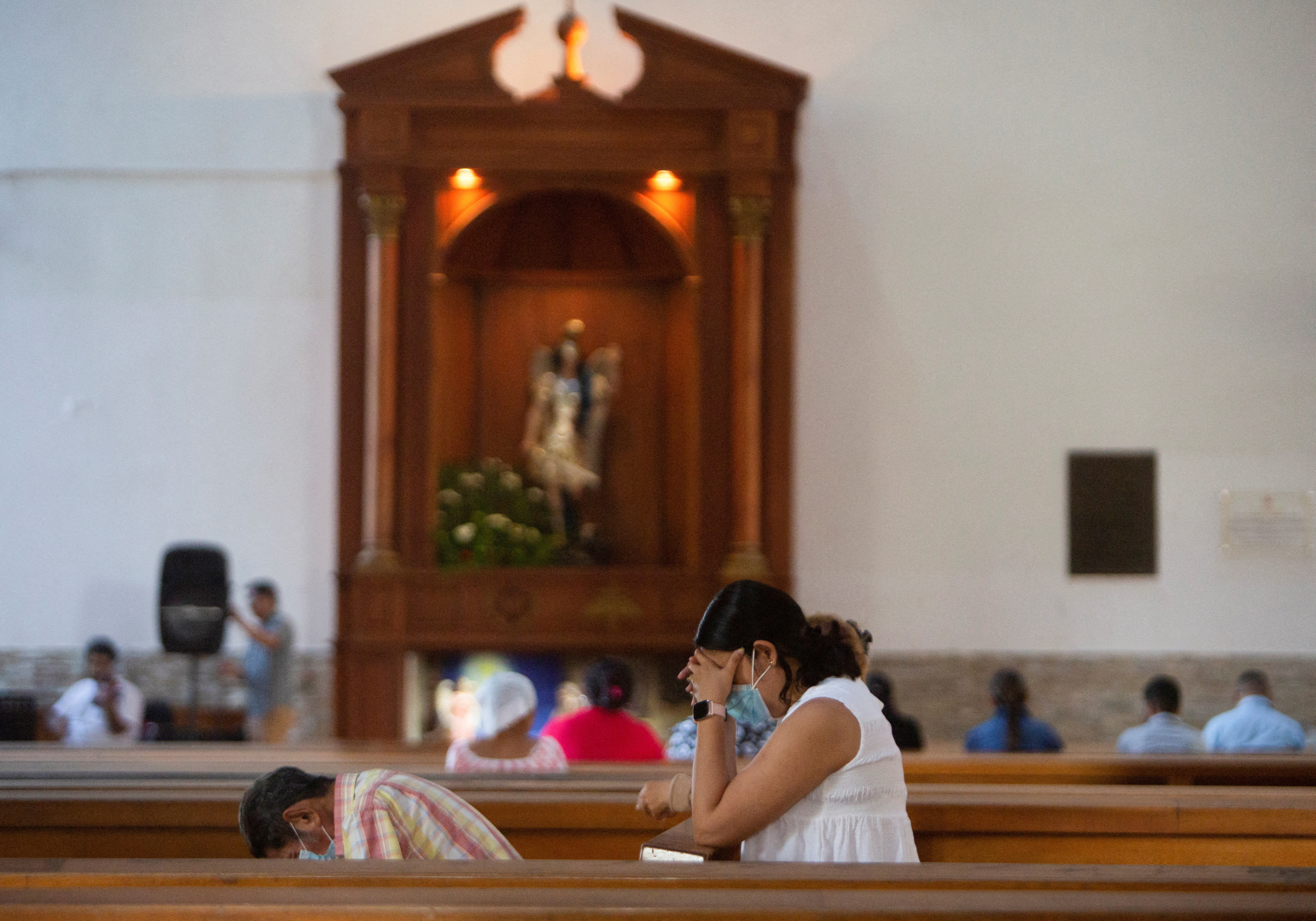 Catholic parishioners pray at the Metropolitan Cathedral, in Managua