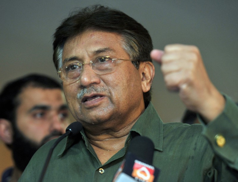 Former President of Pakistan Pervez Musharraf gestures during a news conference in Dubai