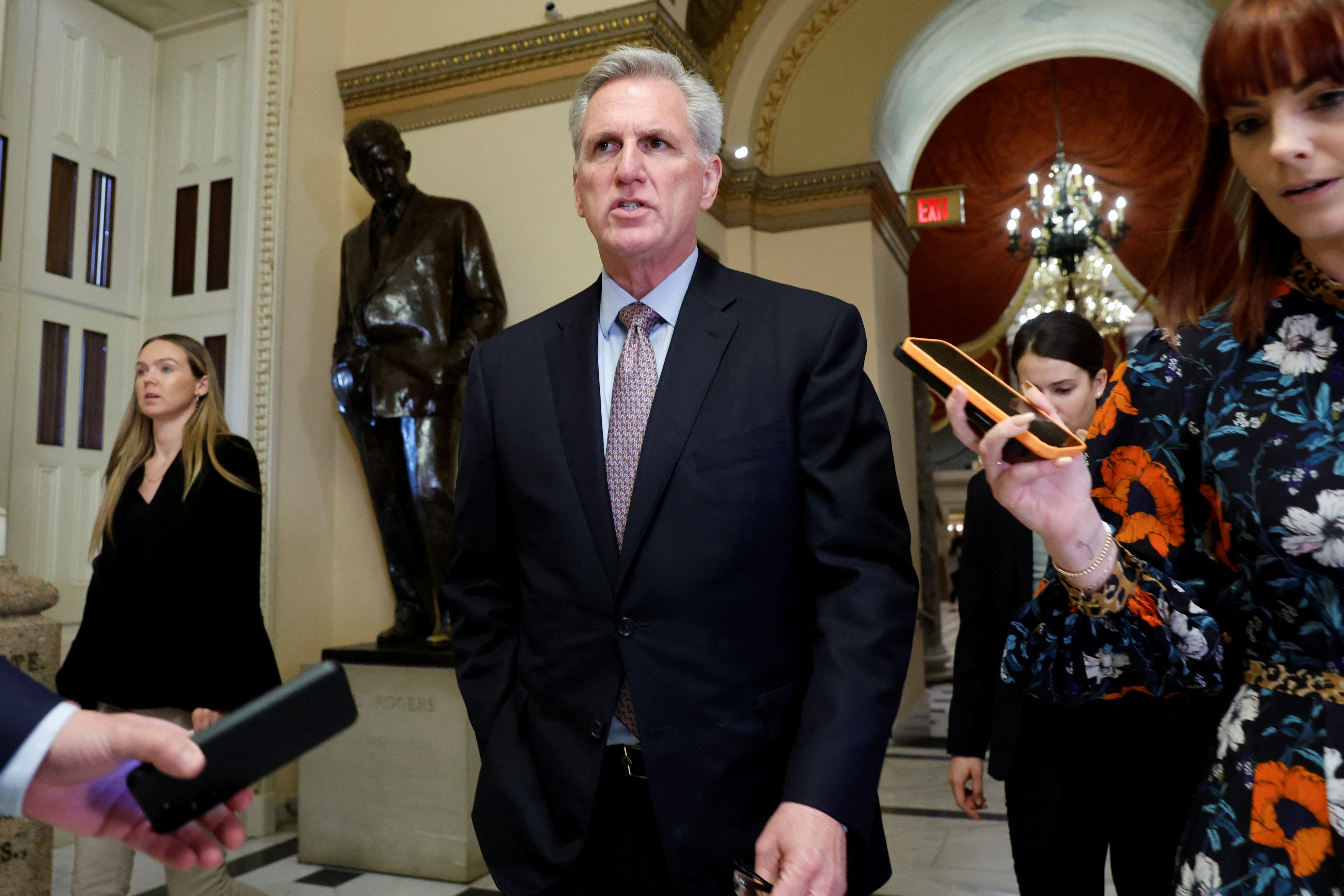 U.S. House Speaker McCarthy is trailed by reporters as he walks to the House floor at the U.S. Capitol in Washington