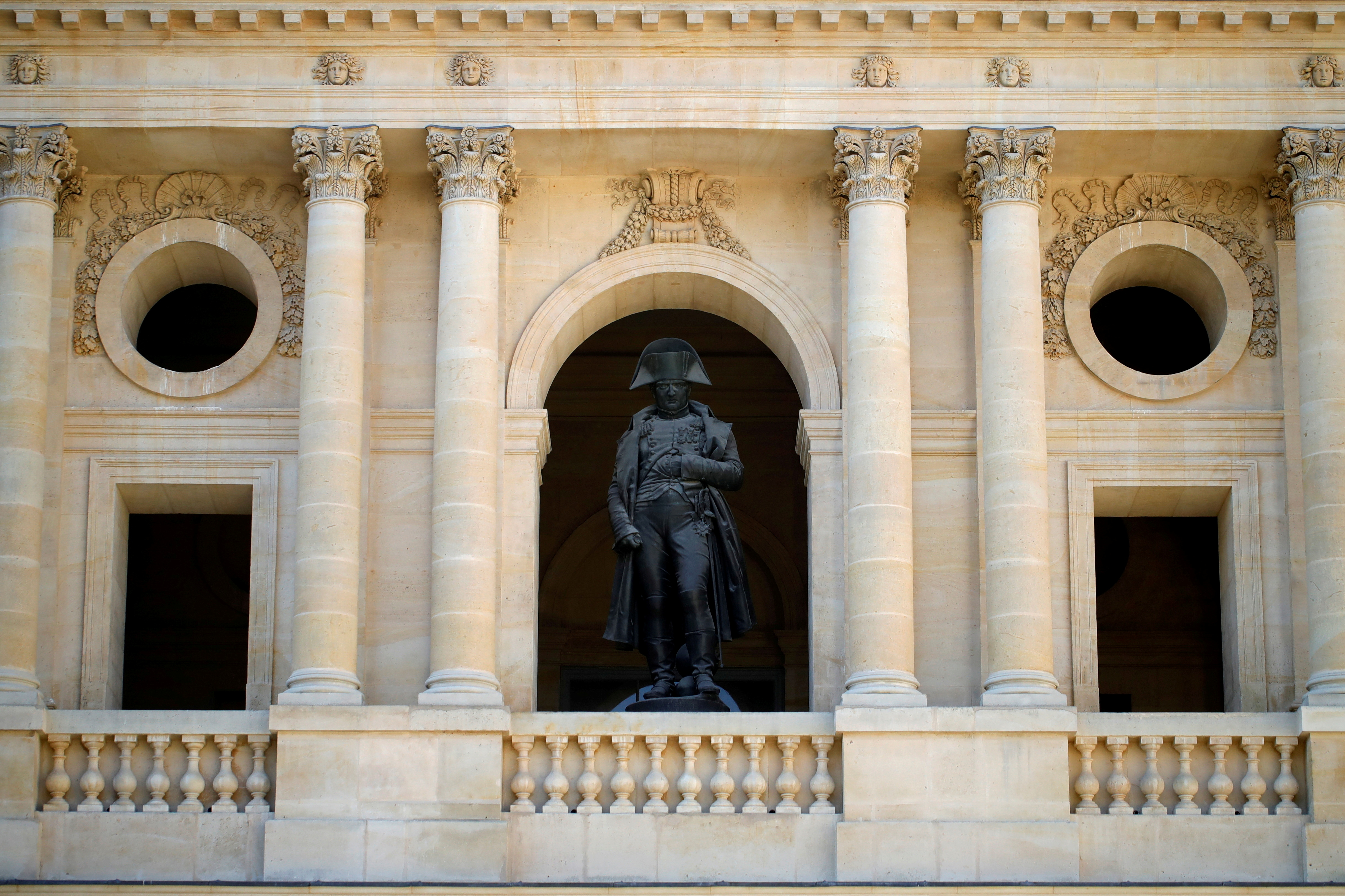 The statue of Napoleon I by sculptor Emile Seurre, made from 16 Russian and Austrian cannons captured from enemy armies in 1805, is seen in the courtyard at the Hotel des Invalides in Paris, France, April 28, 2021. REUTERS/Sarah Meyssonnier/File Photo