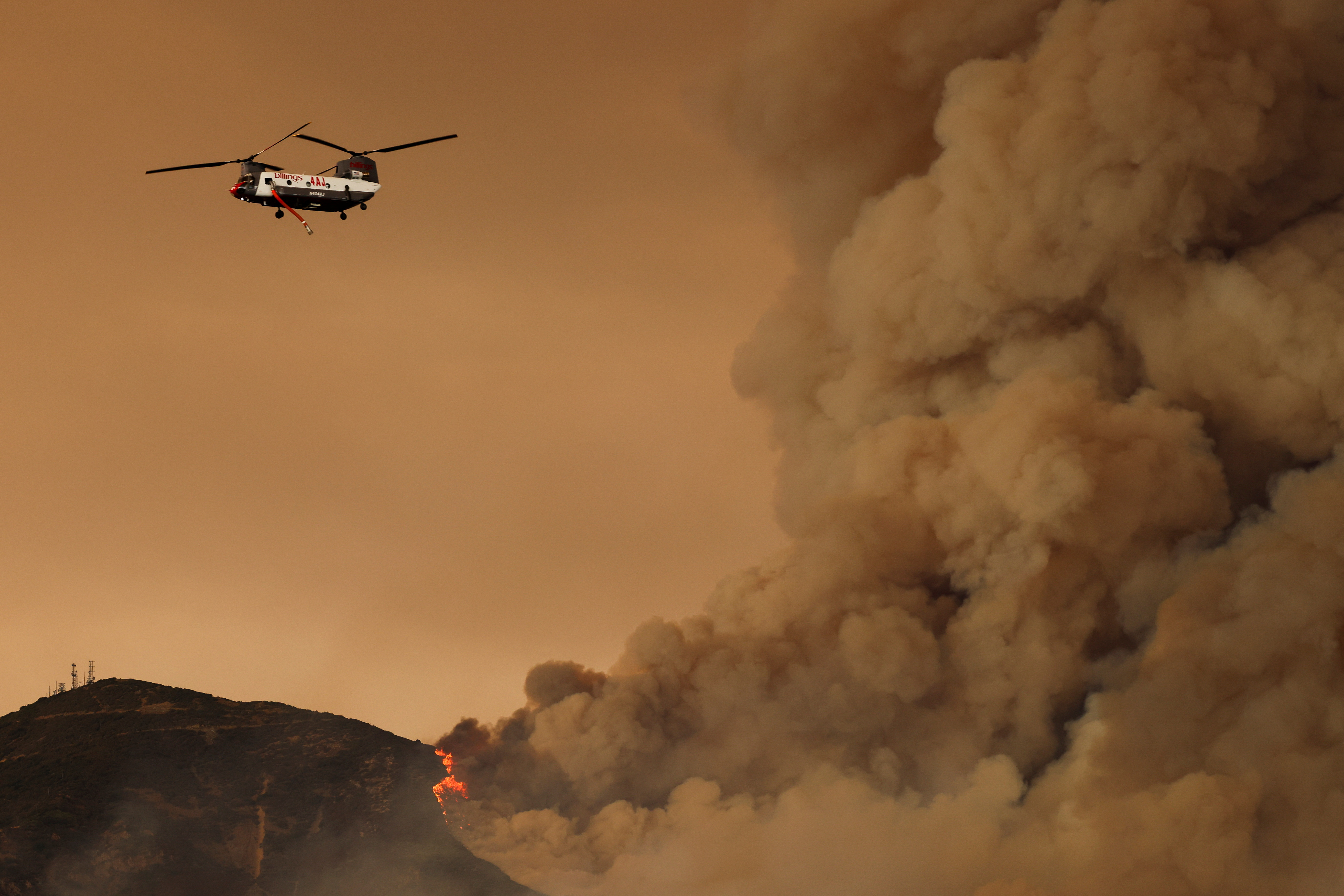 In pictures: California firefighters battle growing Airport Fire