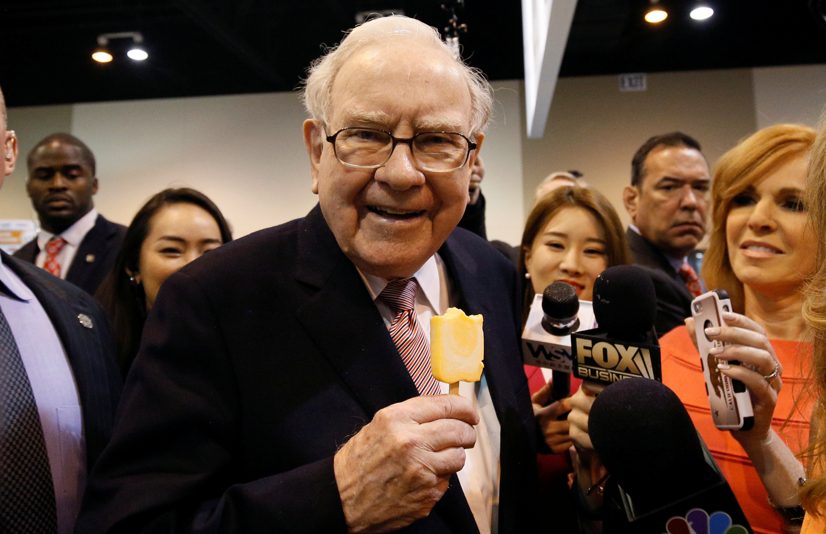 Berkshire Hathaway chairman and CEO Warren Buffett enjoys an ice cream treat from Dairy Queen before the Berkshire's annual meeting in Omaha