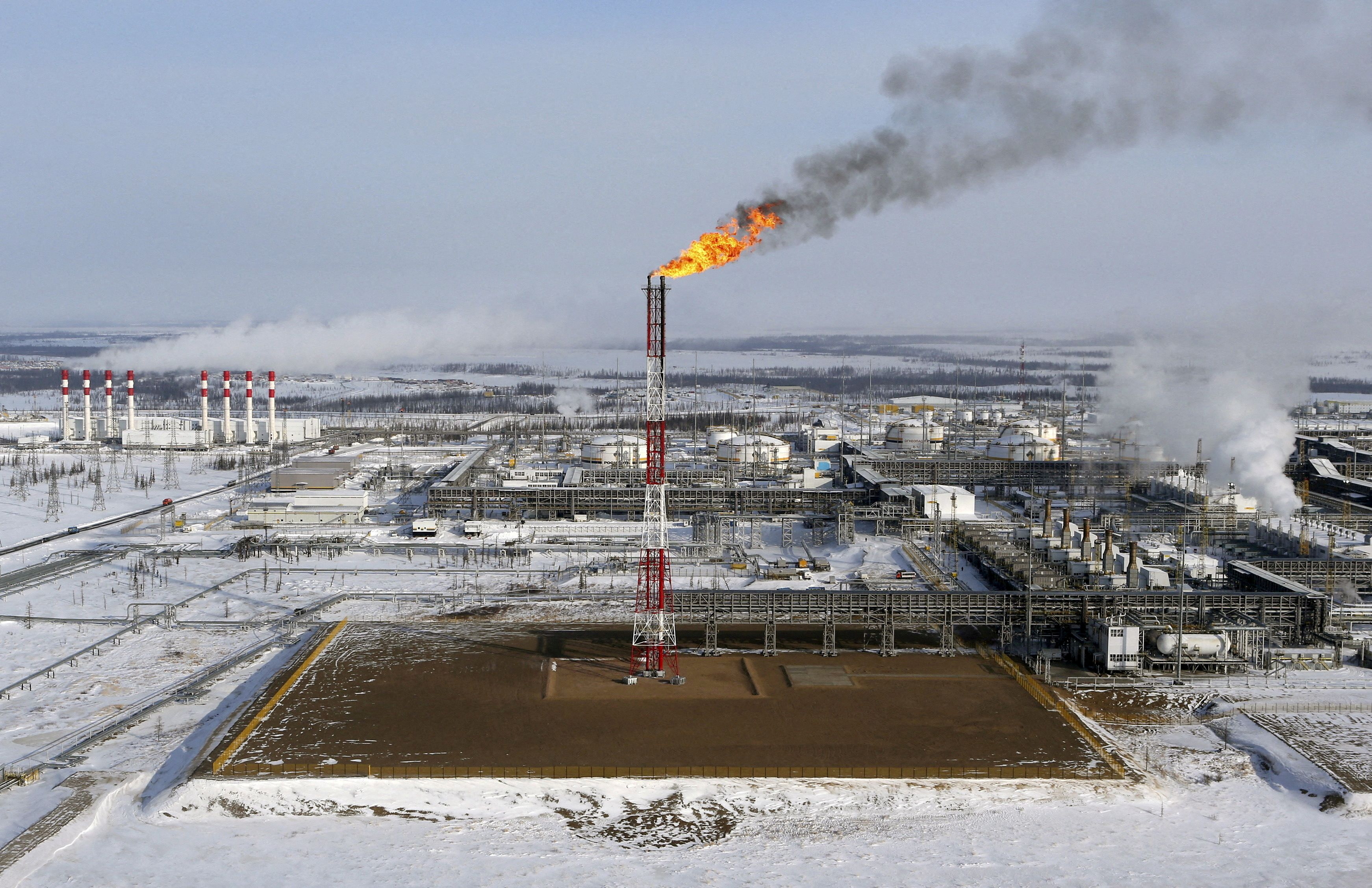 A flame burns from a tower at Vankorskoye oil field owned by Rosneft company north of the Russian Siberian city of Krasnoyarsk