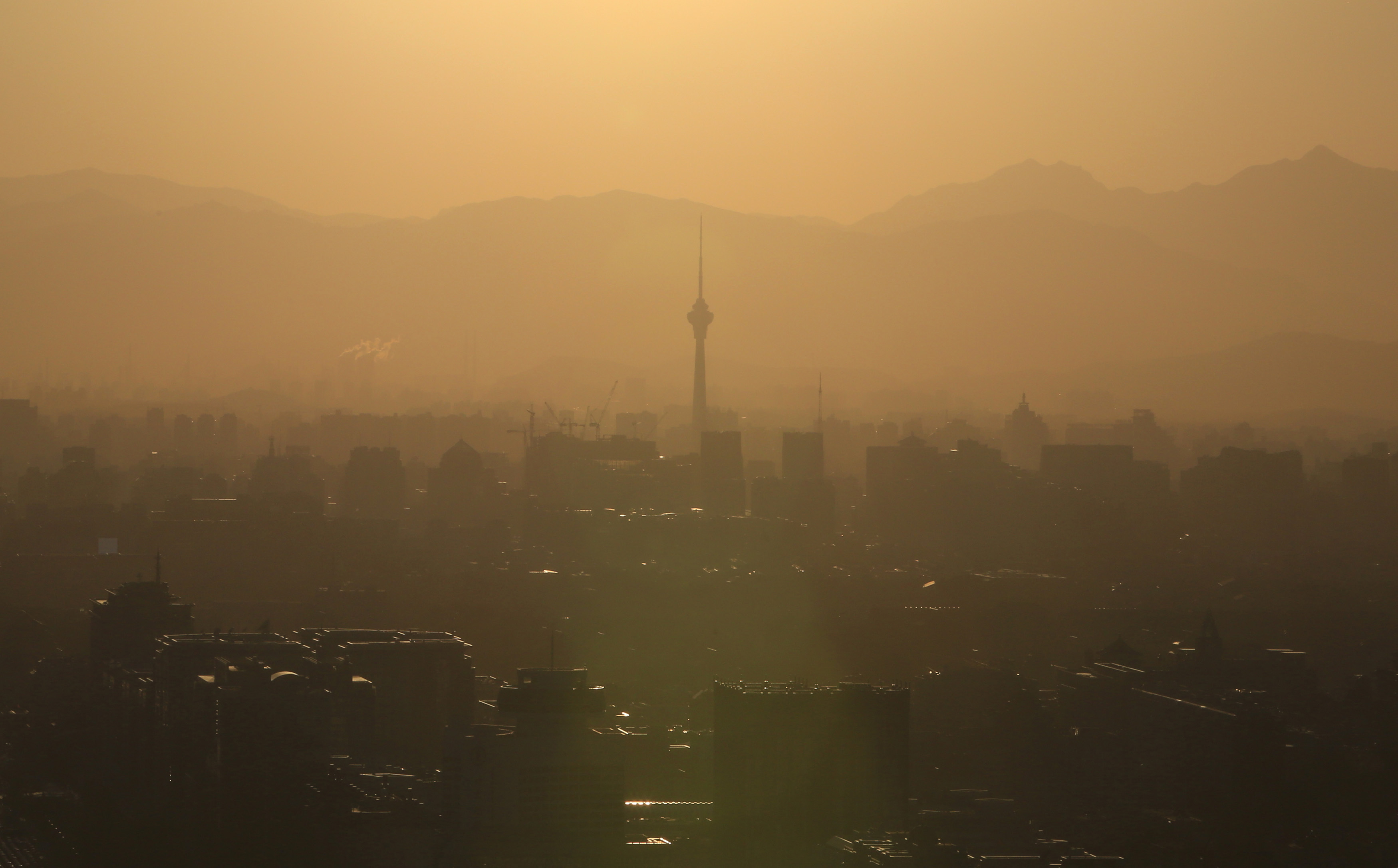 Buildings are seen at sunset in Beijing in Beijing