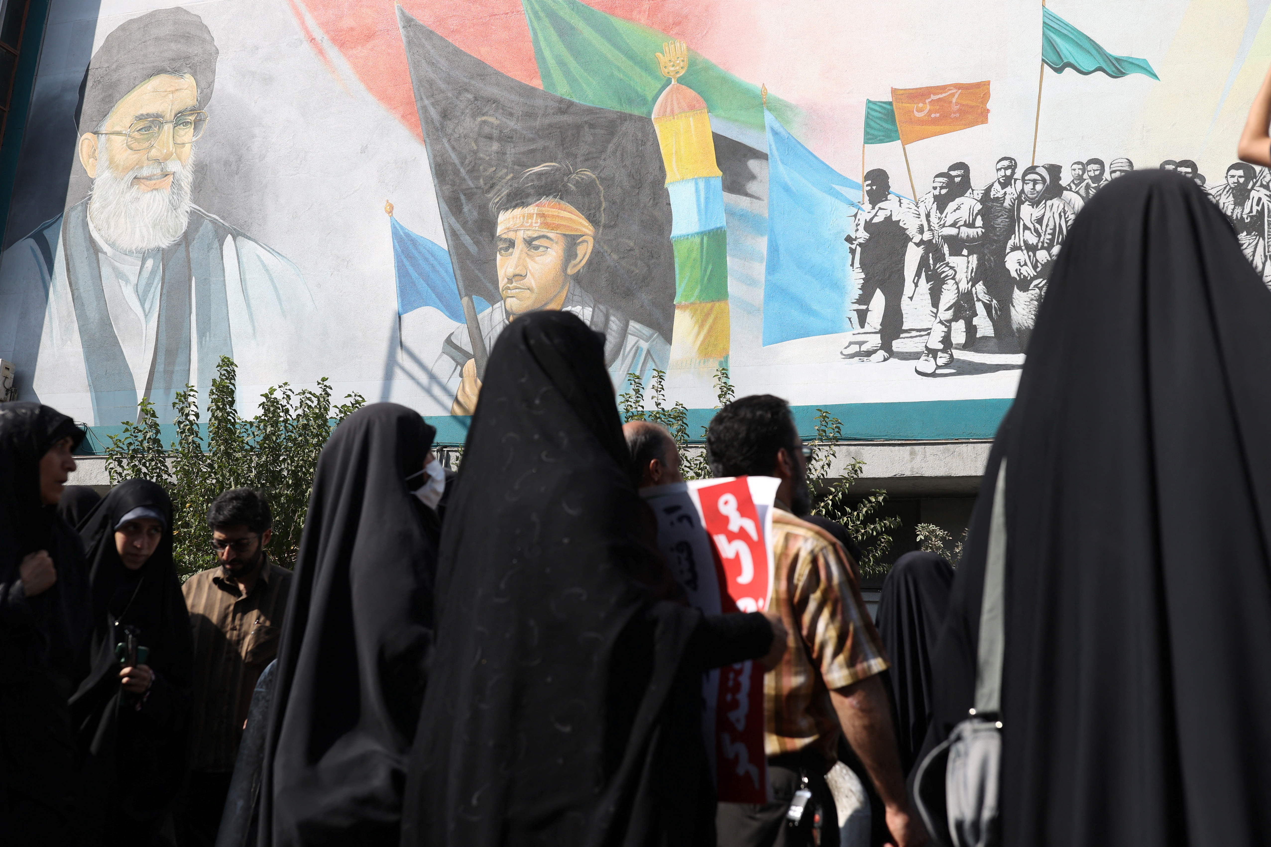 A mural depicting Iran's Supreme Leader Ayatollah Ali Khamenei is seen on a building during a rally against the recent protest gatherings in Iran