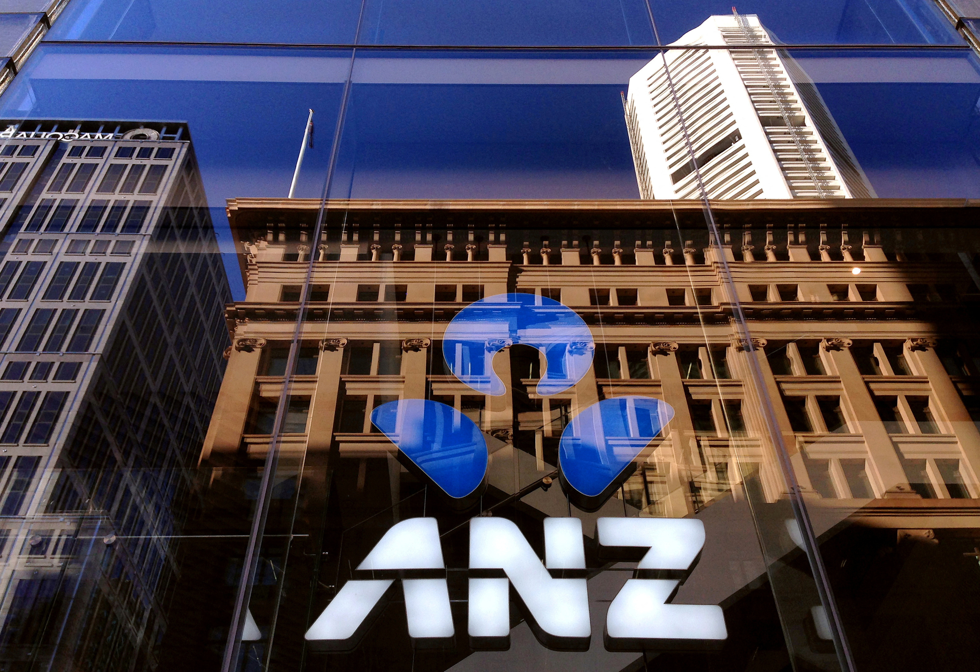 The logo of the ANZ Banking Group is displayed in the window of a branch in central Sydney, Australia