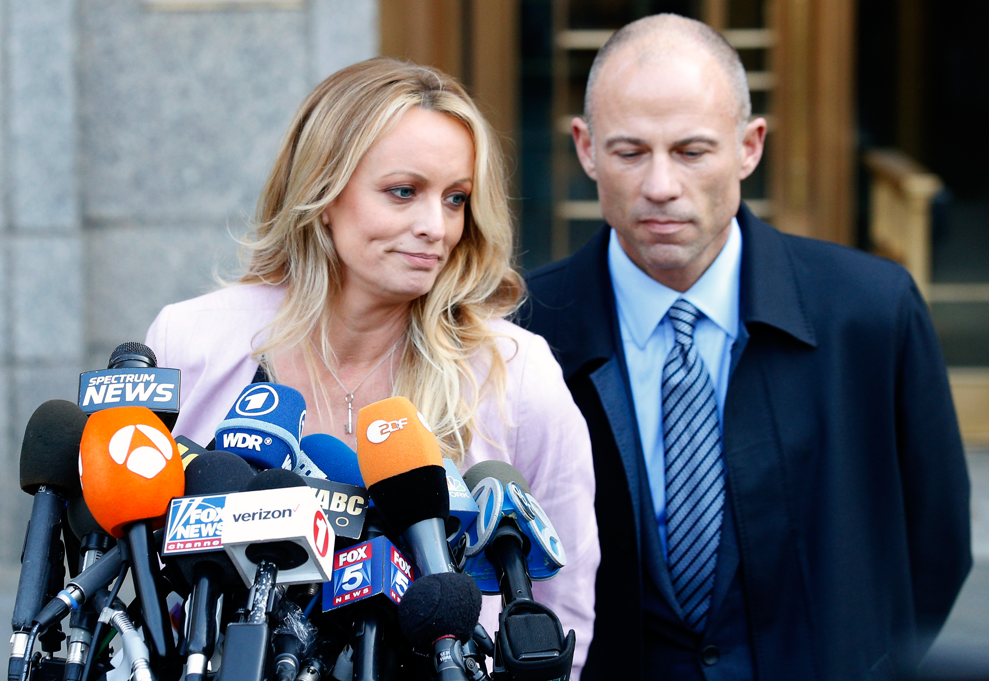 Adult film actress Stephanie Clifford, also known as Stormy Daniels, speaks to media along with lawyer Michael Avenatti  outside federal court in Manhattan