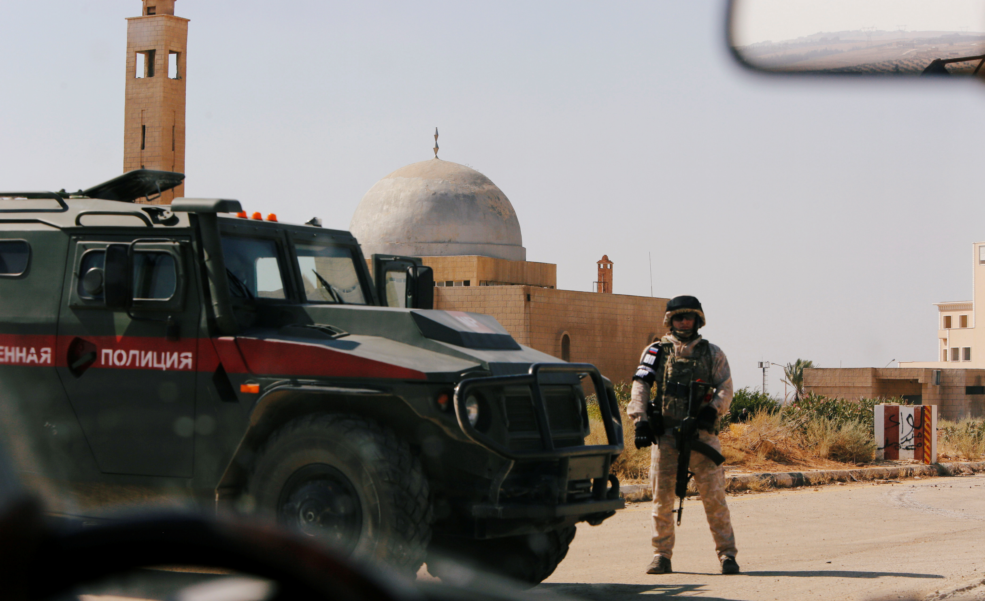 A Russian soldier is seen near the Nasib border crossing with Jordan in Deraa