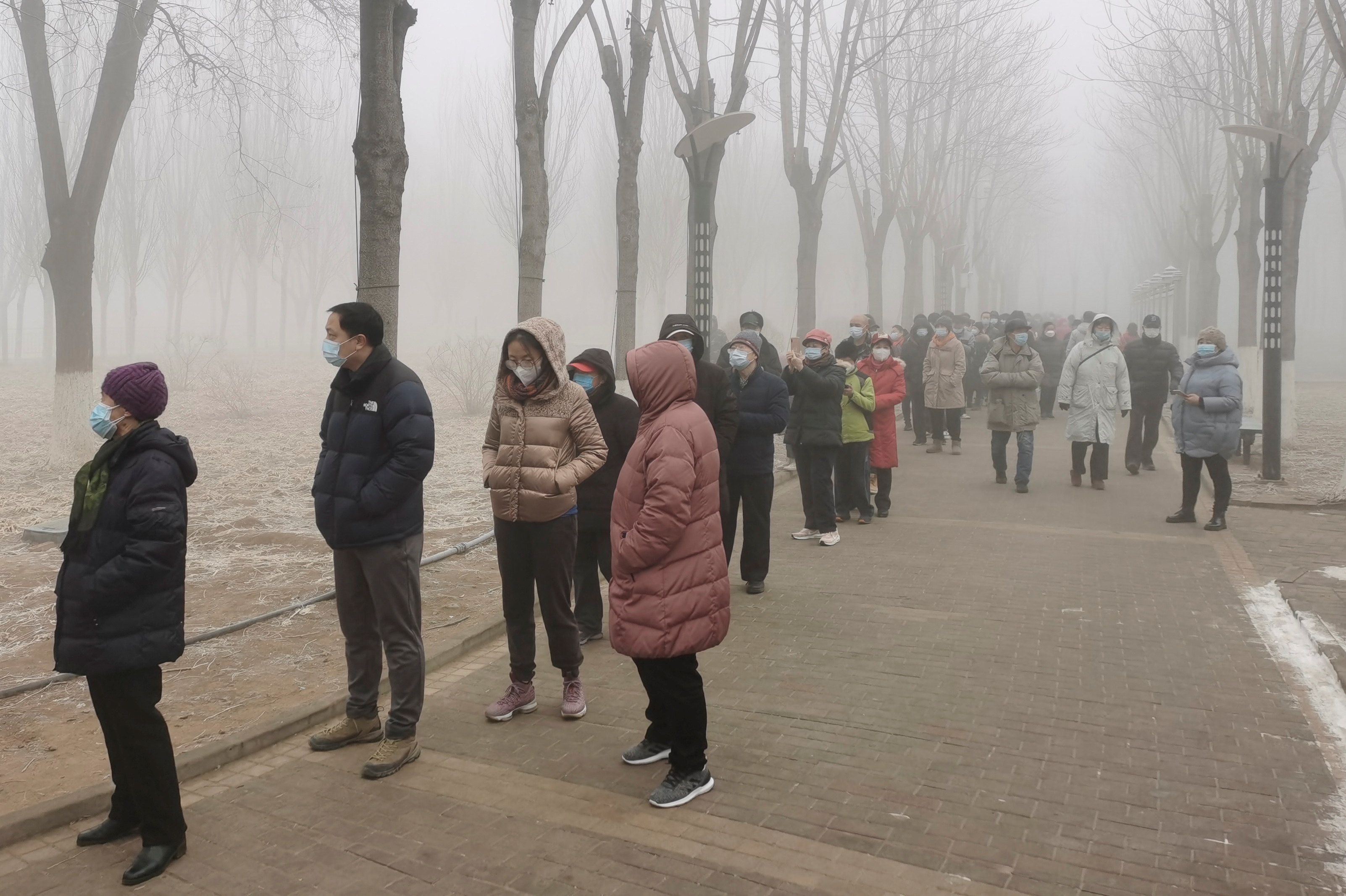 People line up for nucleic acid testing in Beijing