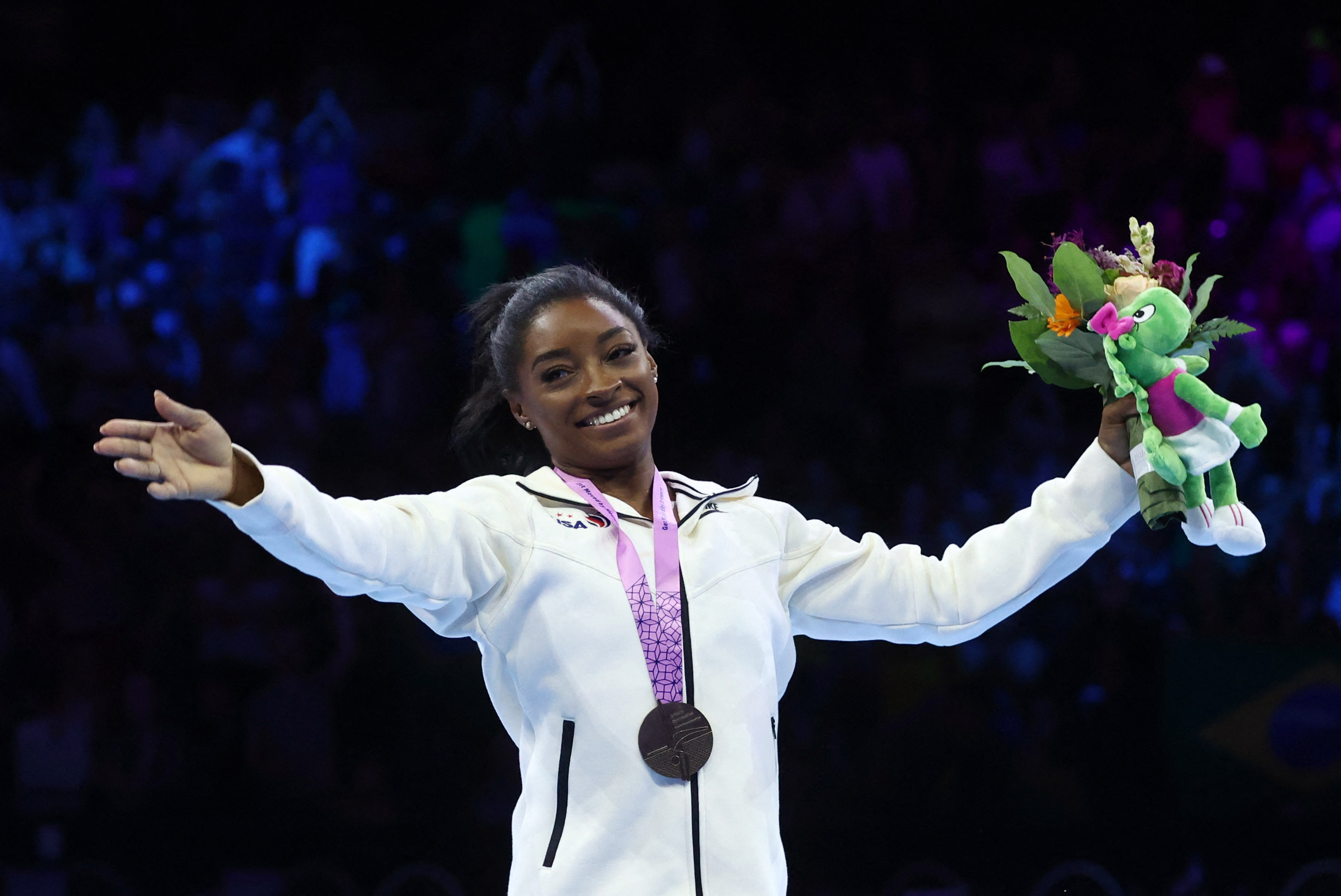 Simone Biles and Jake Jarman enjoy golden day at world