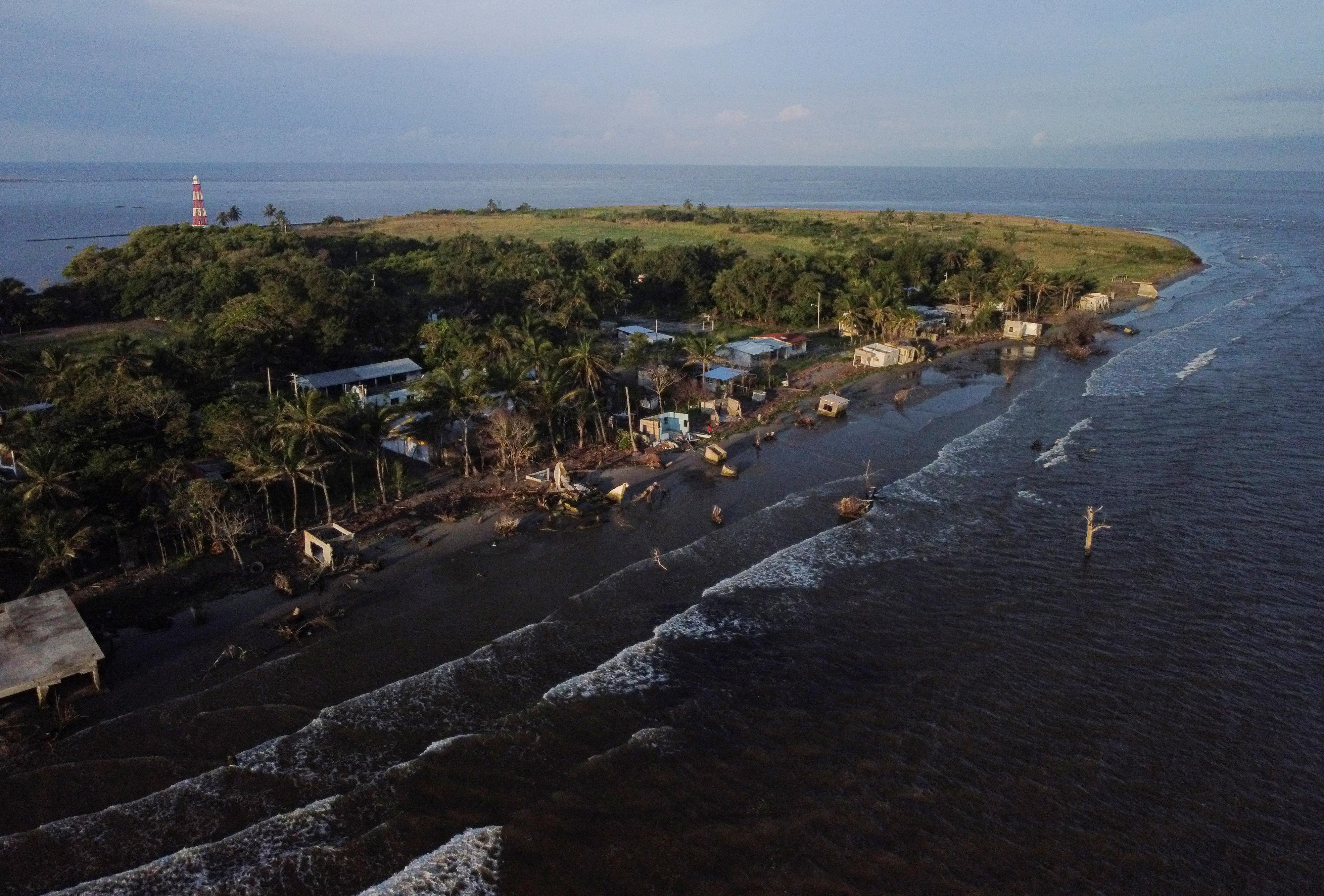 Mexican village blames climate change as sea swallows its homes, in El Bosque