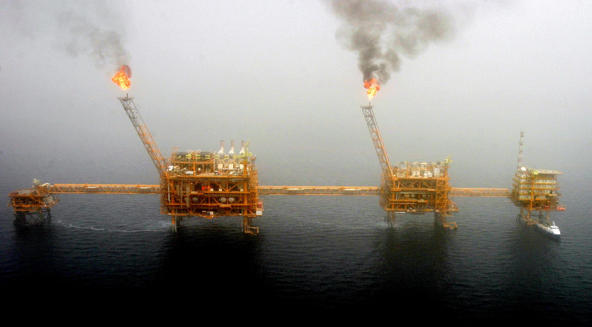 Gas flares from an oil production platform are seen at the Soroush oil fields.