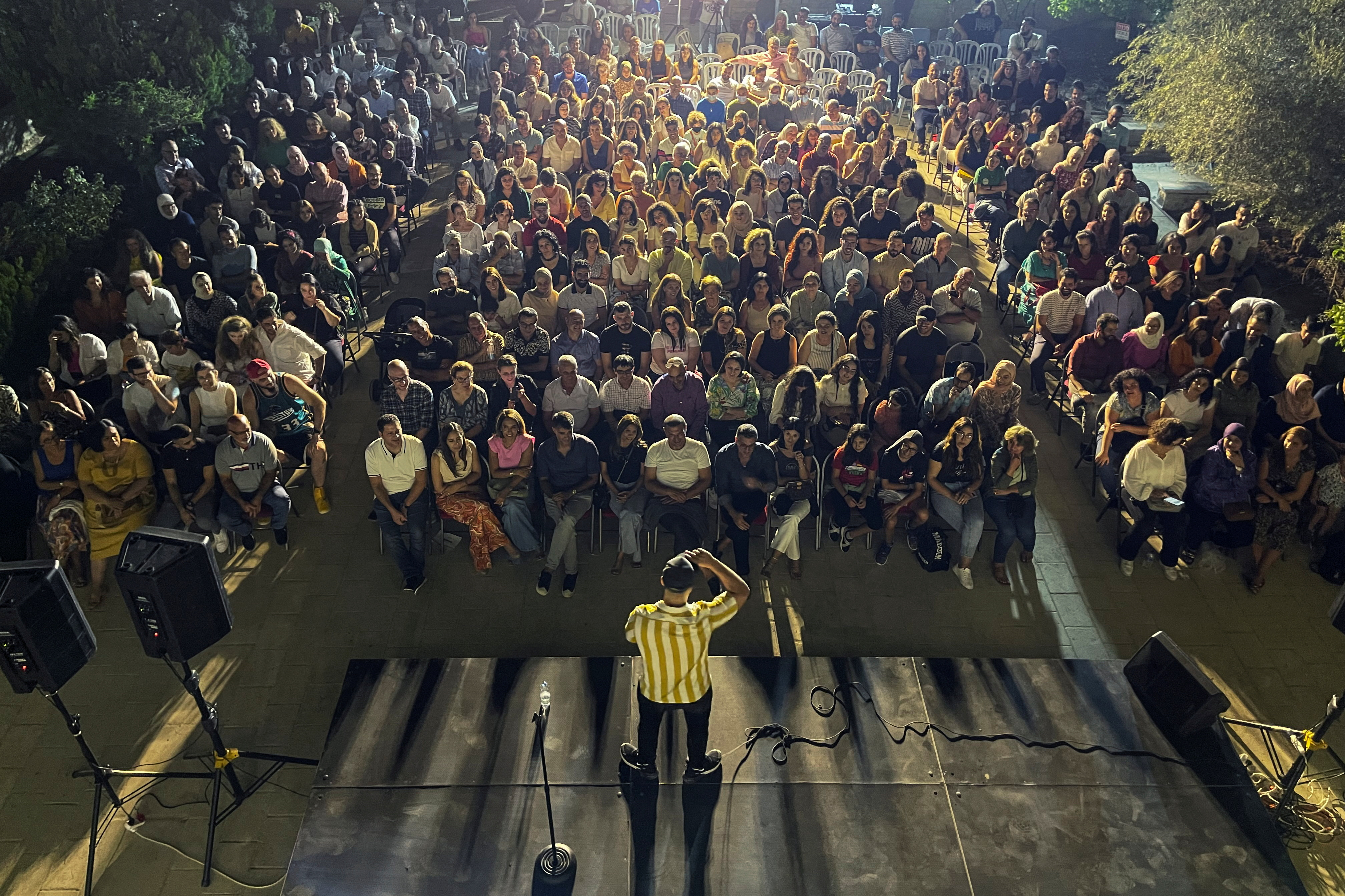 Palestinian American comedian, Joe Abousakher, preforms during the Palestine Comedy Festival in Jerusalem