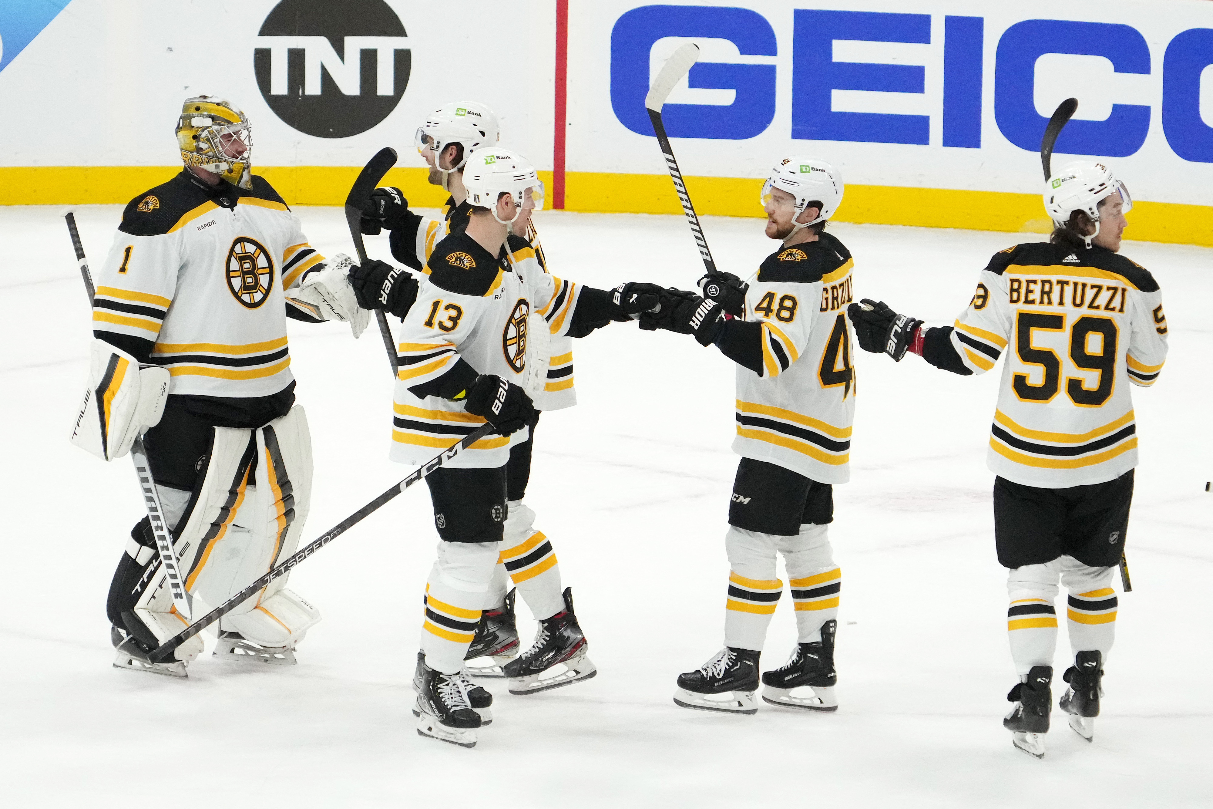 Boston Bruins' Linus Ullmark, left, celebrates with fellow goalie