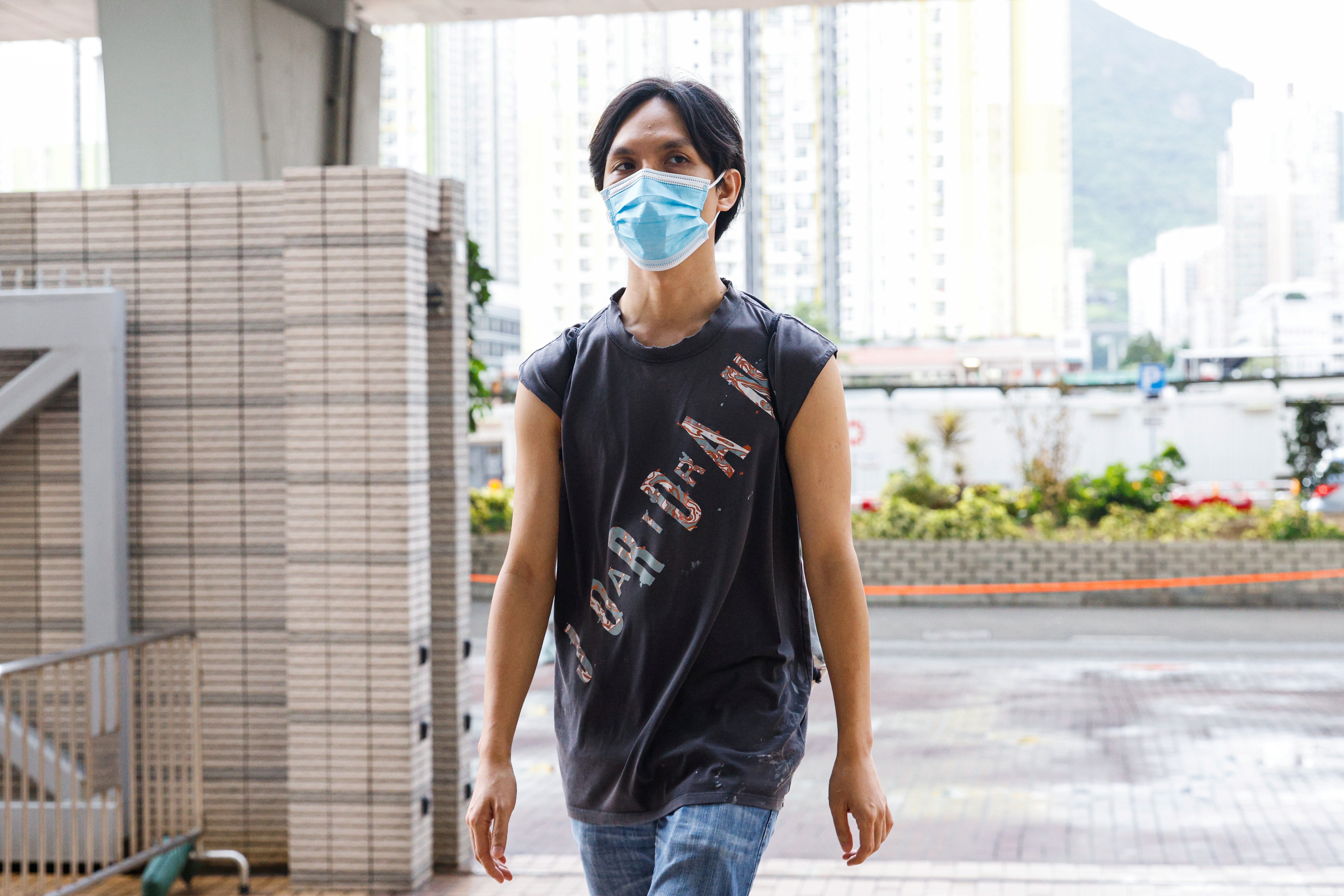 Pro-democracy activist Hendick Lui Chi Hang, one of the 47 pro-democracy activists charged with conspiracy to commit subversion under the national security law, arrives West Kowloon Magistrates's Courts building, in Hong Kong
