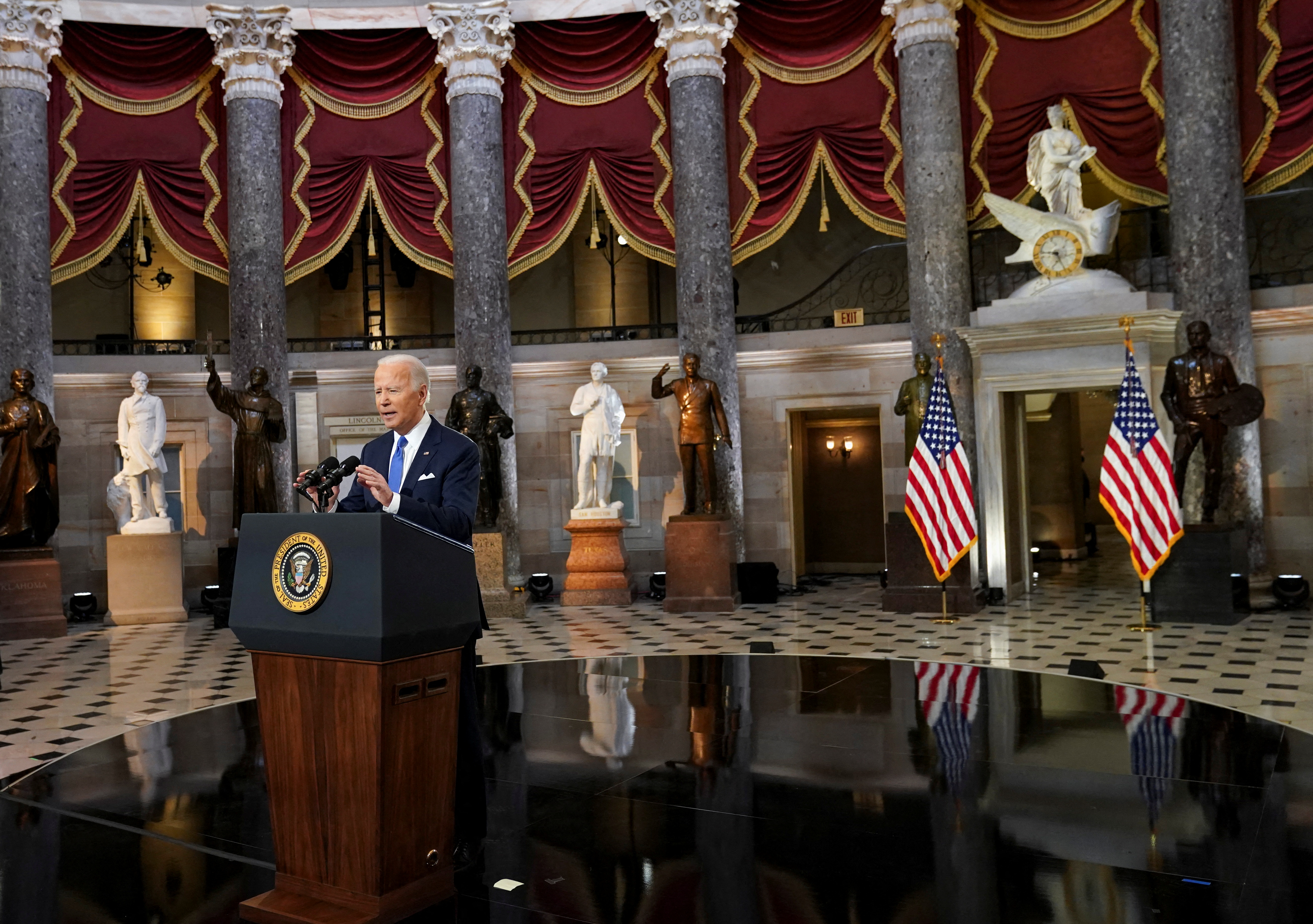 U.S. President Joe Biden speaks in Statuary Hall on the first anniversary of the January 6, 2021 attack on the U.S. Capitol by supporters of former President Donald Trump, on Capitol Hill in Washington, U.S., January 6, 2022. REUTERS/Kevin Lamarque