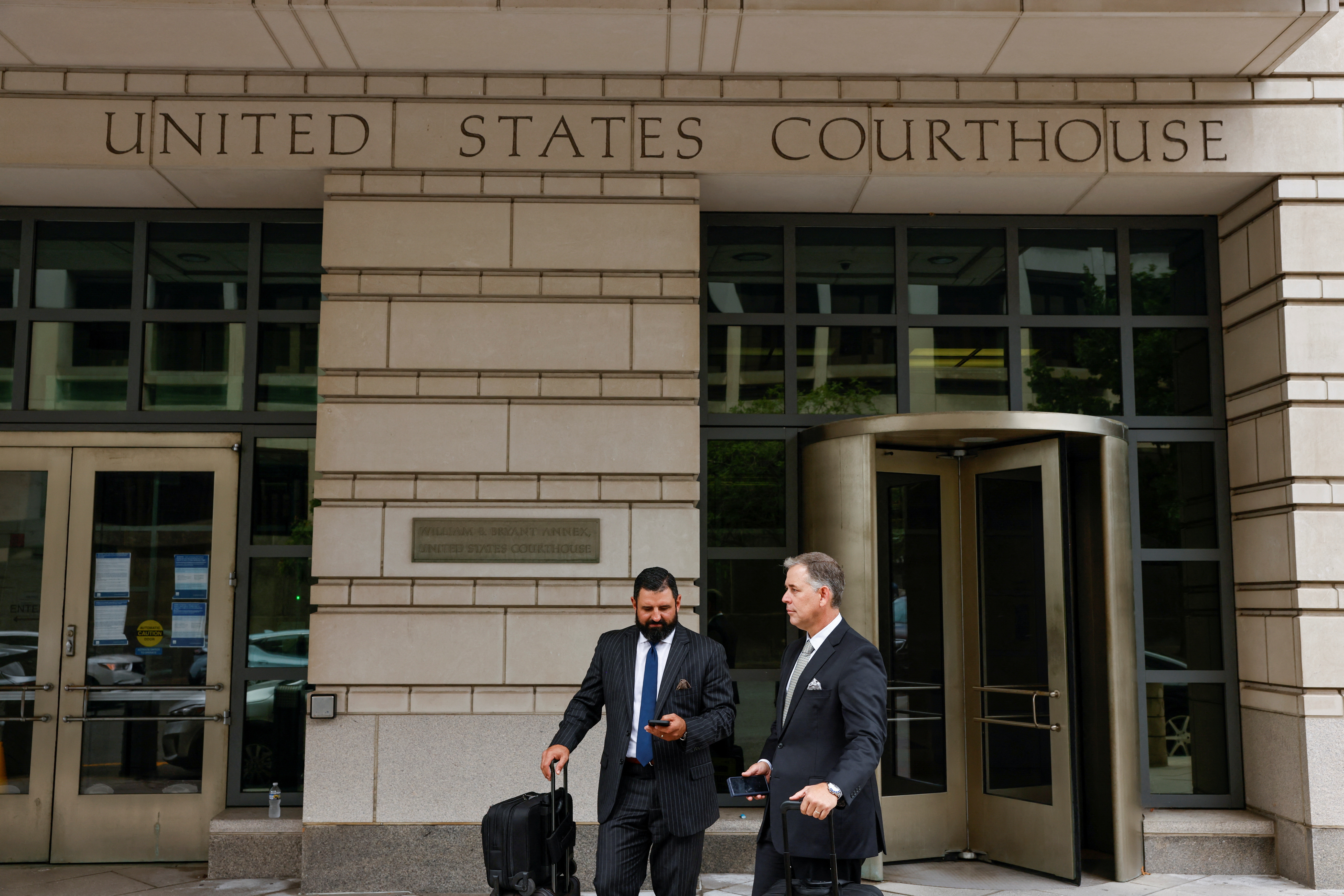 Nayib Hassan, the lawyer of Former Proud Boys chairman Enrique Tarrio, stands outside of the U.S. Federal Courthouse after the sentencing was postponed due to an emergency, in Washington D.C