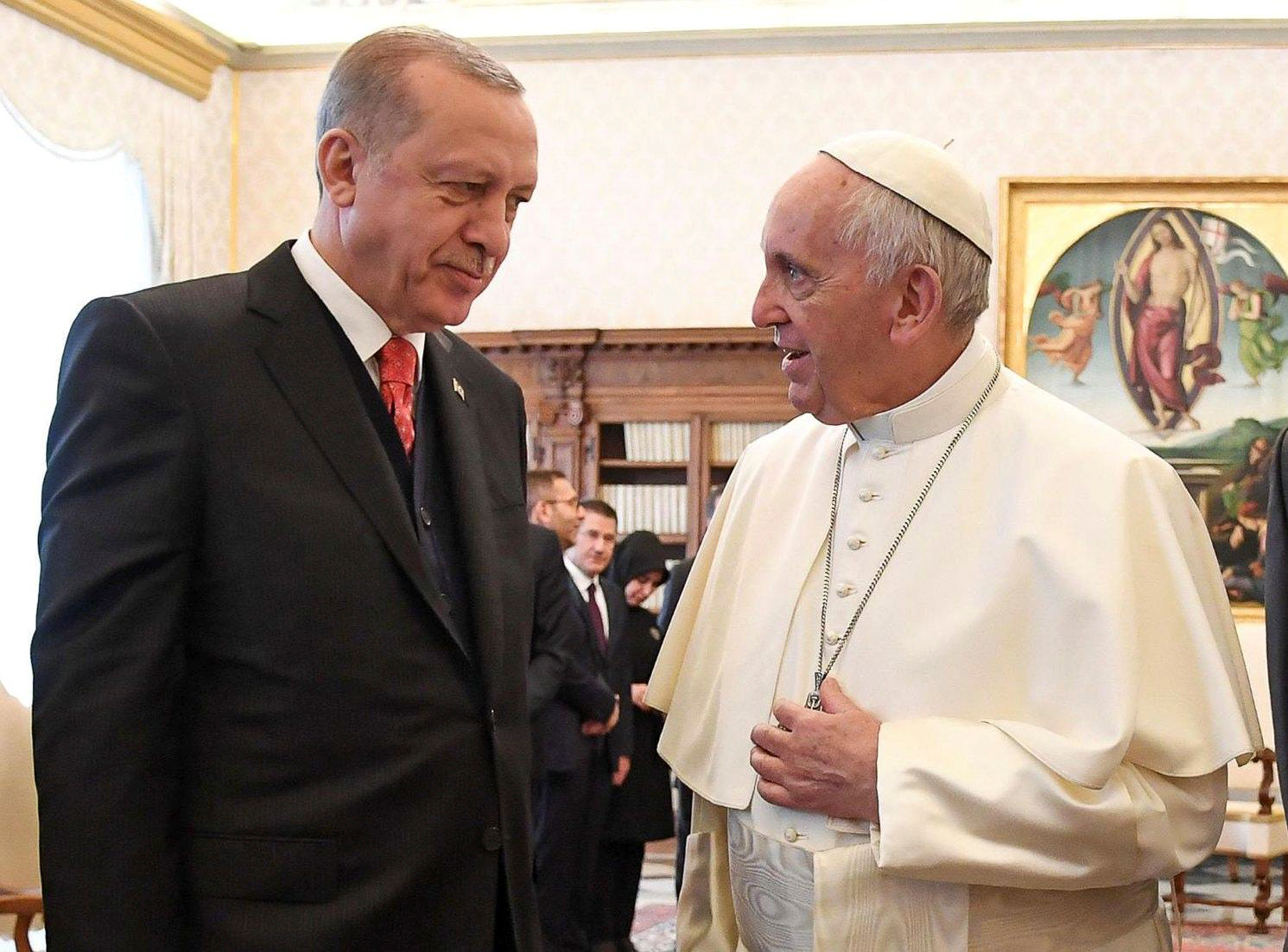 Pope Francis talks with Turkish President Tayyip Erdogan during a private audience at the Vatican